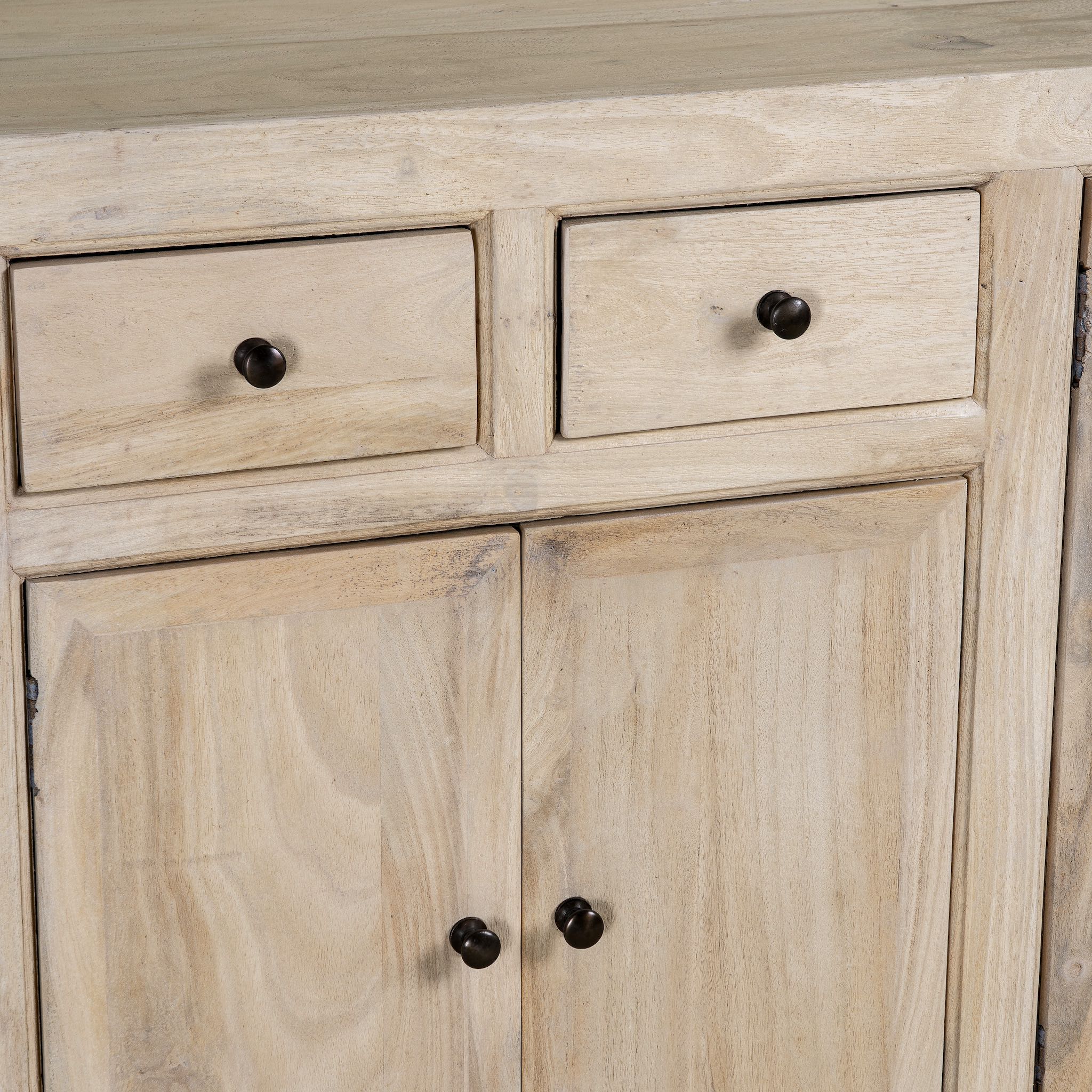 Close up image of a sandblasted wooden sideboard with three compartments and two small drawers, Ibiza style living room furniture in light natural finish, 200×40×90 cm.
