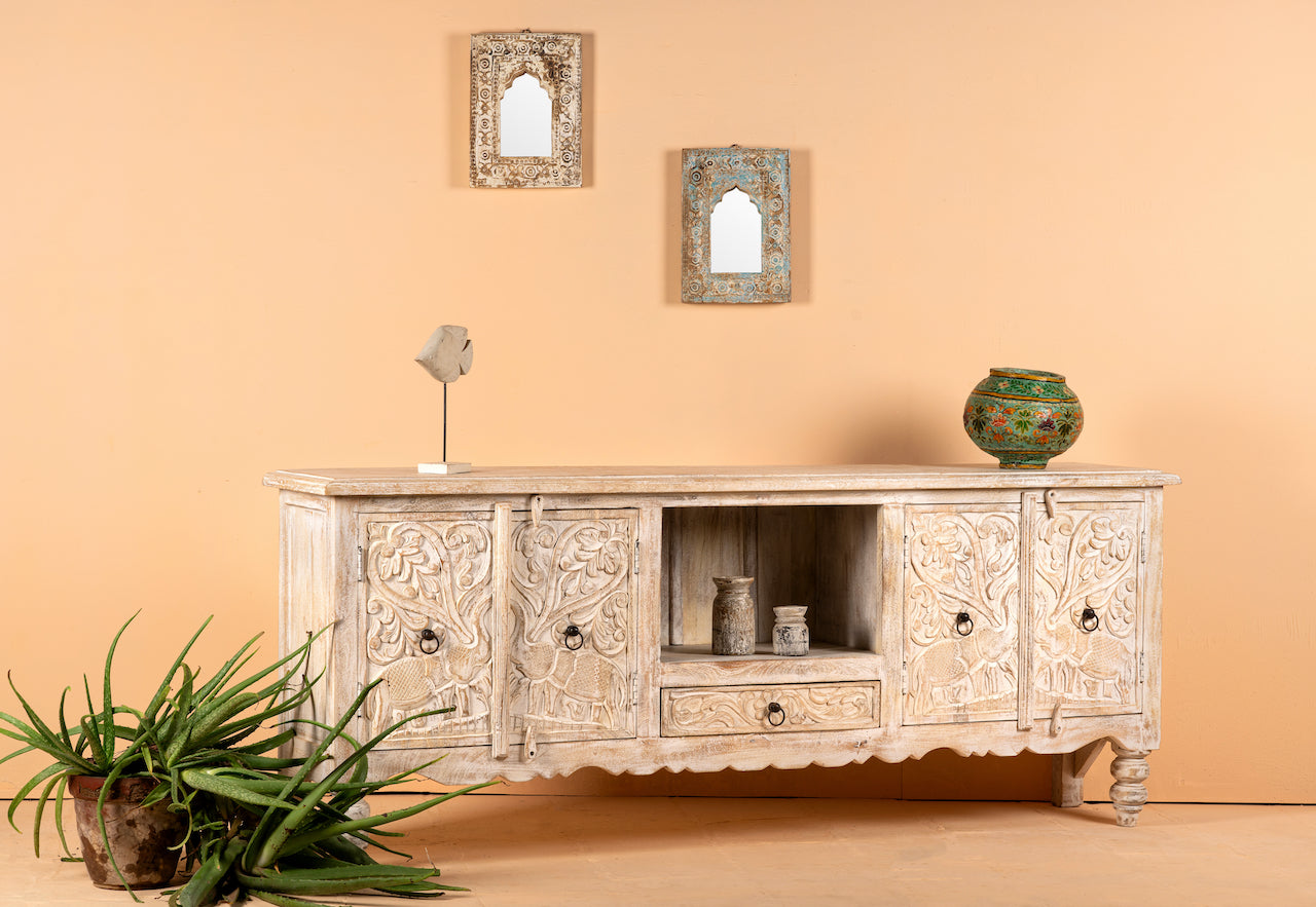 Side angle image of a hand-carved traditional sideboard made from mango wood with whitewashed floral detailing; perfect as entryway table vintage or TV unit, 198 × 82 × 40 cm.