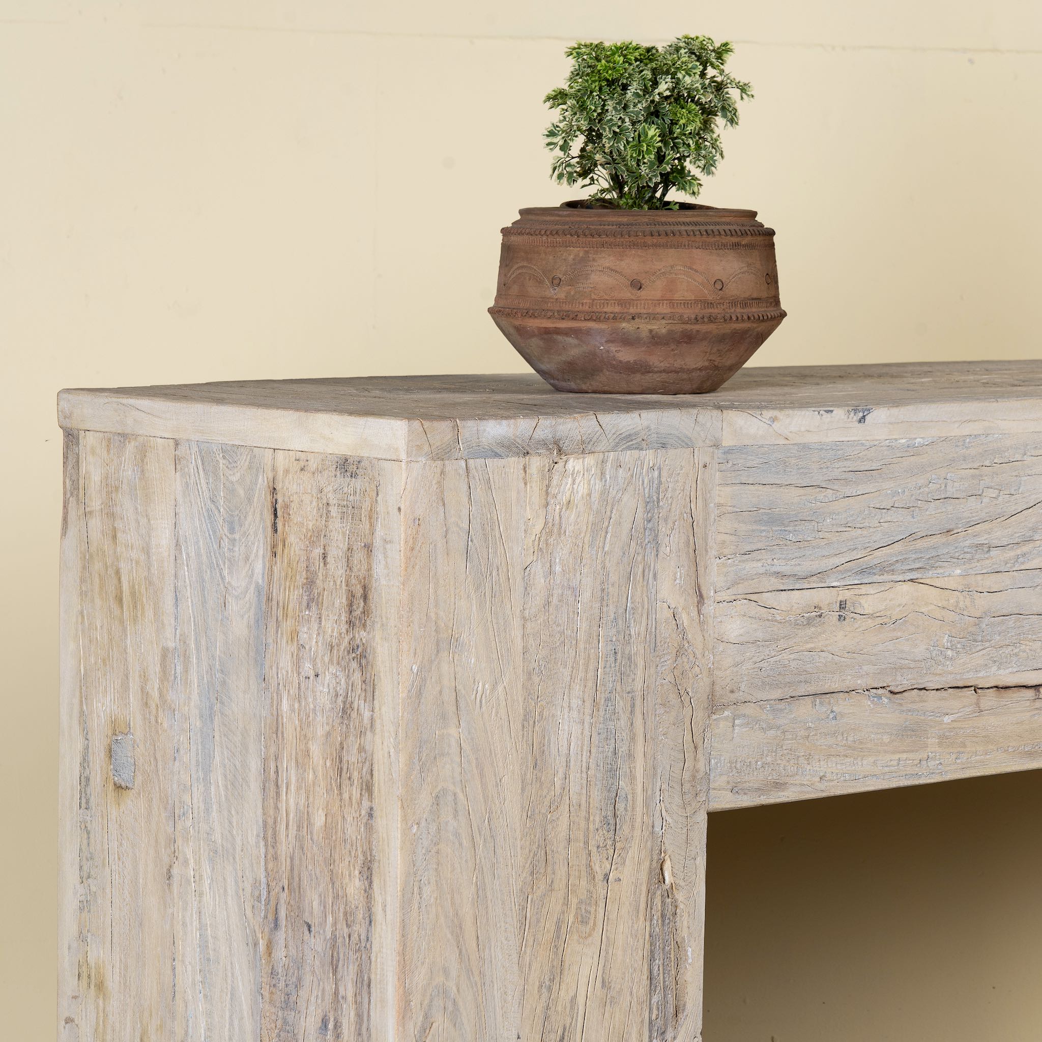 Close up image of a minimalist reclaimed wood console in Ibiza style with light sun-washed finish, 250cm length.