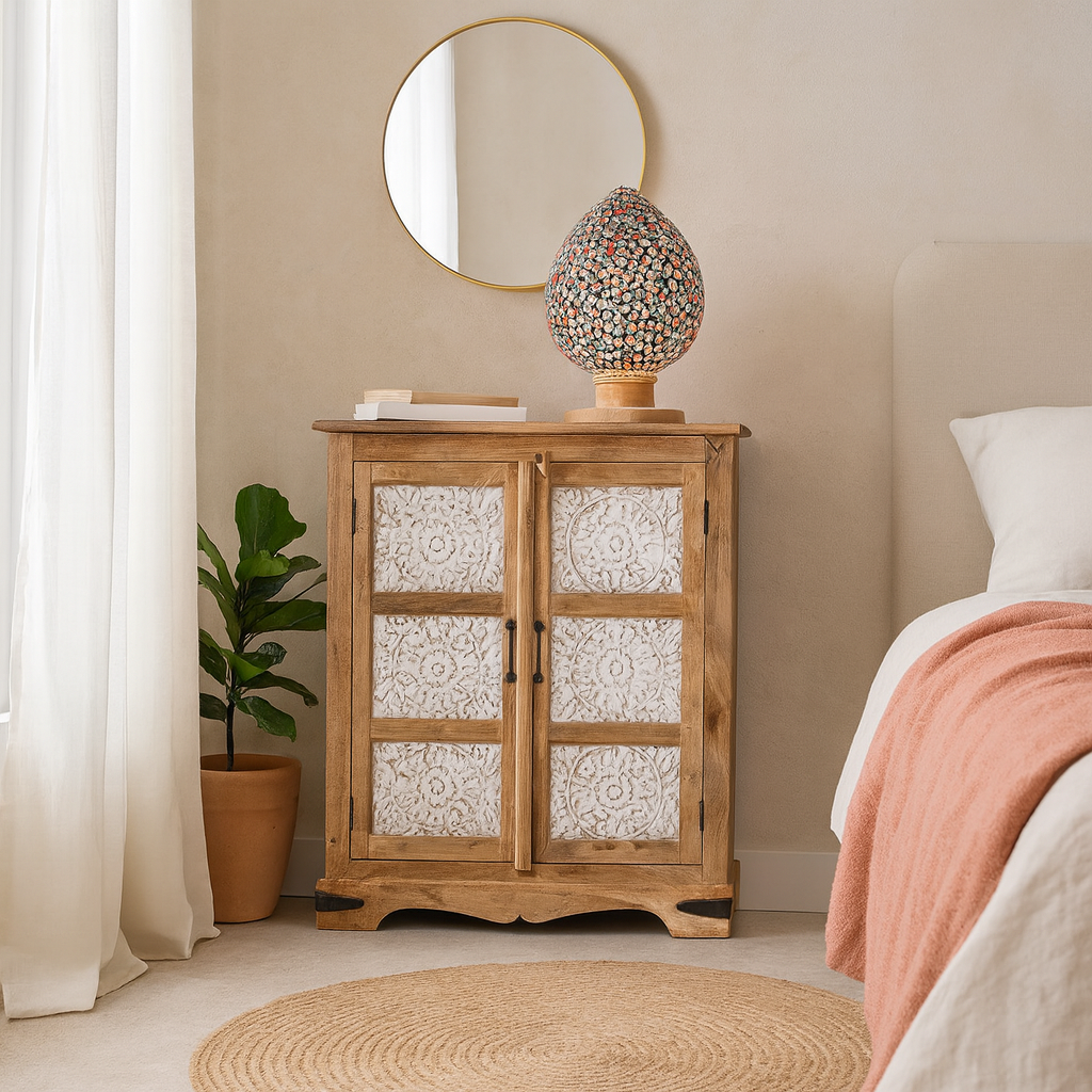 Lifestyle imagination of a carved sideboard / bedroom furniture in mango wood with white-washed floral engravings, 90 × 40 × 100 cm.
