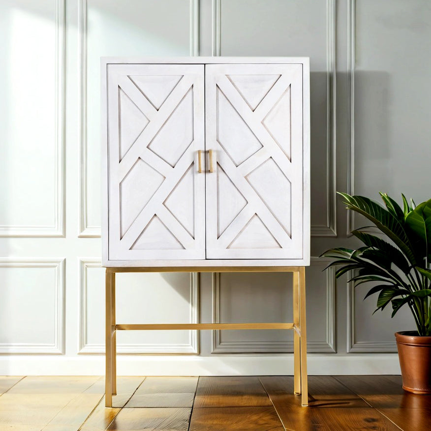 A natural mango wooden buffet cabinet with a white washed finish and gold brass legs, featuring a carved line design.