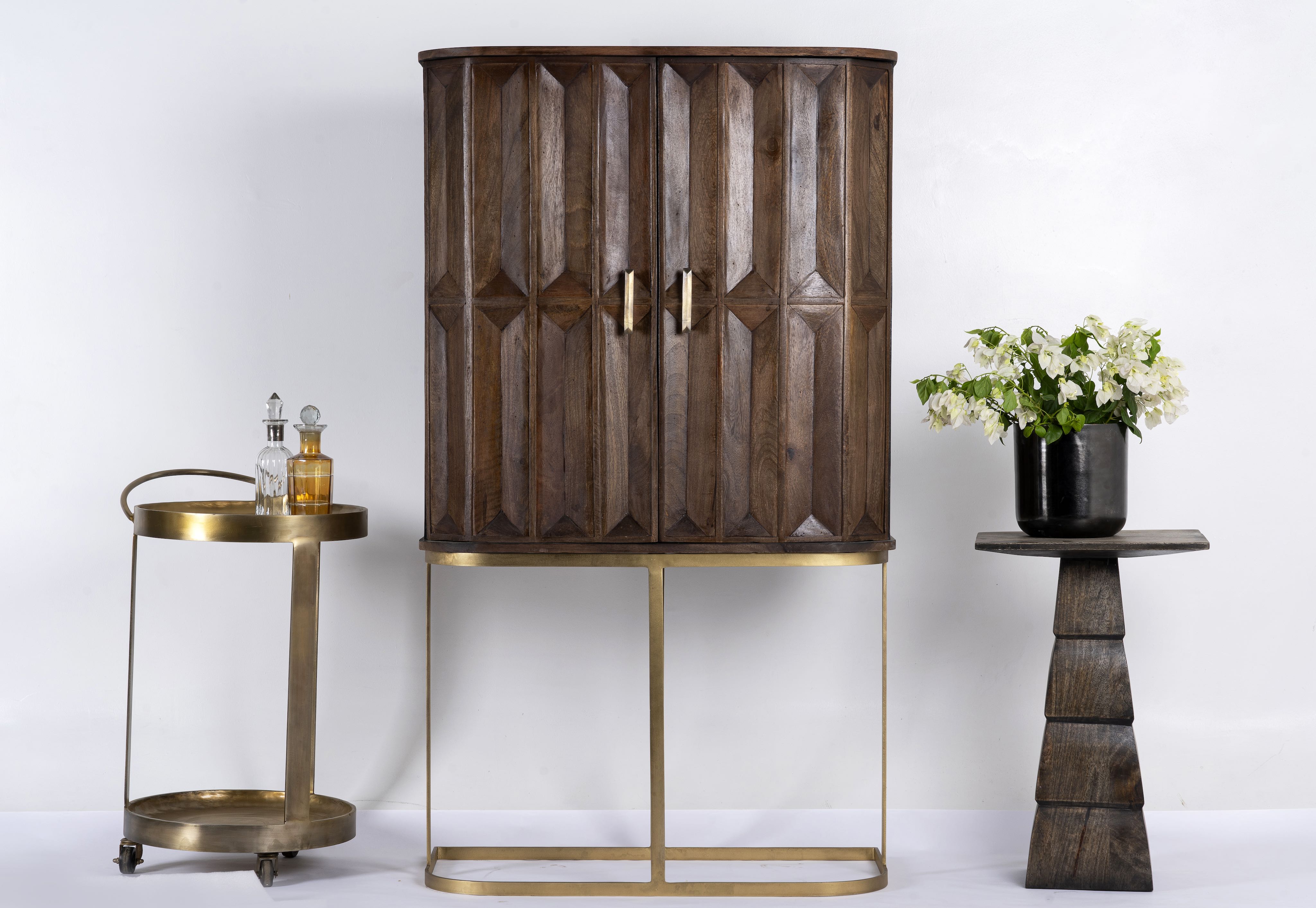 Tall mango wood cabinet with diamond tile carving, bronze handles, and black metal base, 86 × 42 × 150 cm.