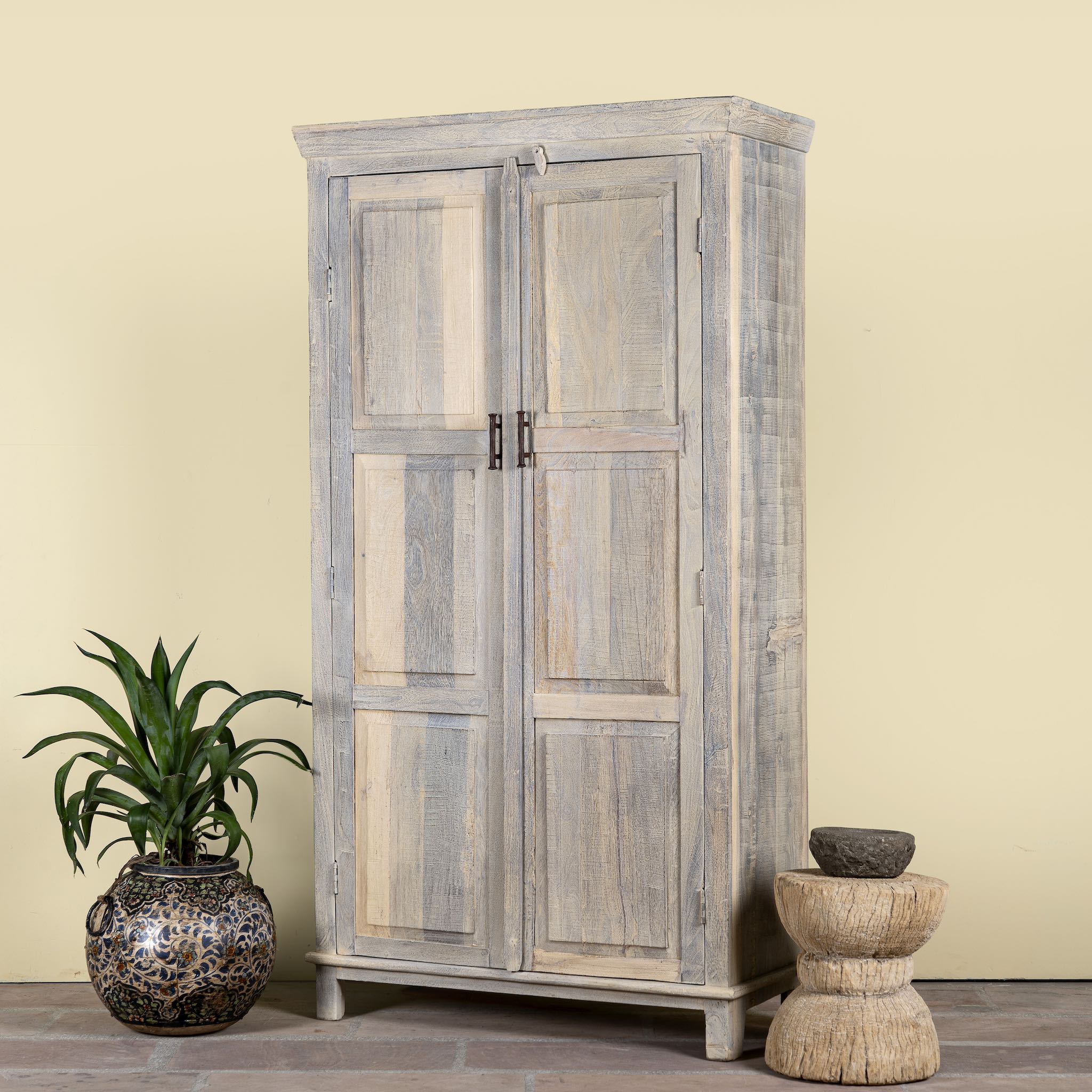 Side angle image of a reclaimed wood wardrobe with panelled double doors and rustic finish; bathroom furniture with ample storage, 100 × 45 × 190 cm.