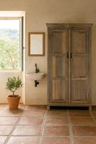 Lifestyle inspiration of a reclaimed wood wardrobe with panelled double doors and rustic finish; bathroom furniture with ample storage, 100 × 45 × 190 cm.