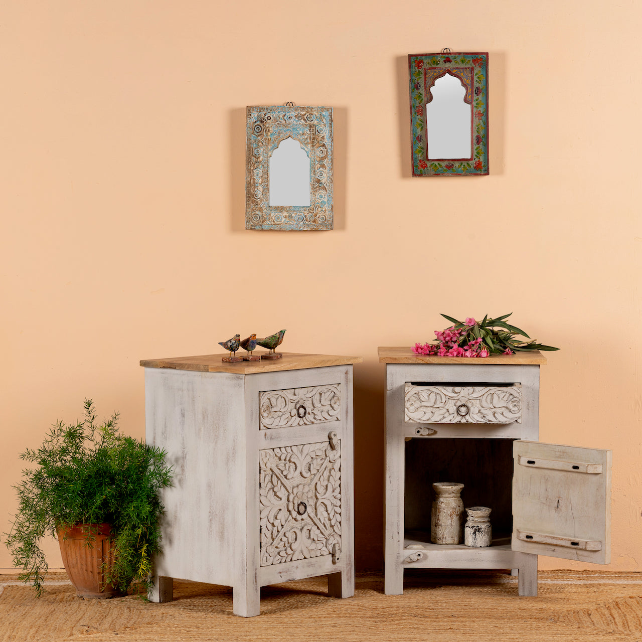 Open door image of a pair of vintage night stands in mango wood with hand-carved geometric details and distressed finish; ideal for vintage home decor, 76 × 56 × 35 cm.