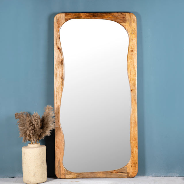 Mango wood mirror Bana with tall, arched frame and natural finish. A handcrafted piece of rustic wall art perfect for Mediterranean and minimalist interiors.