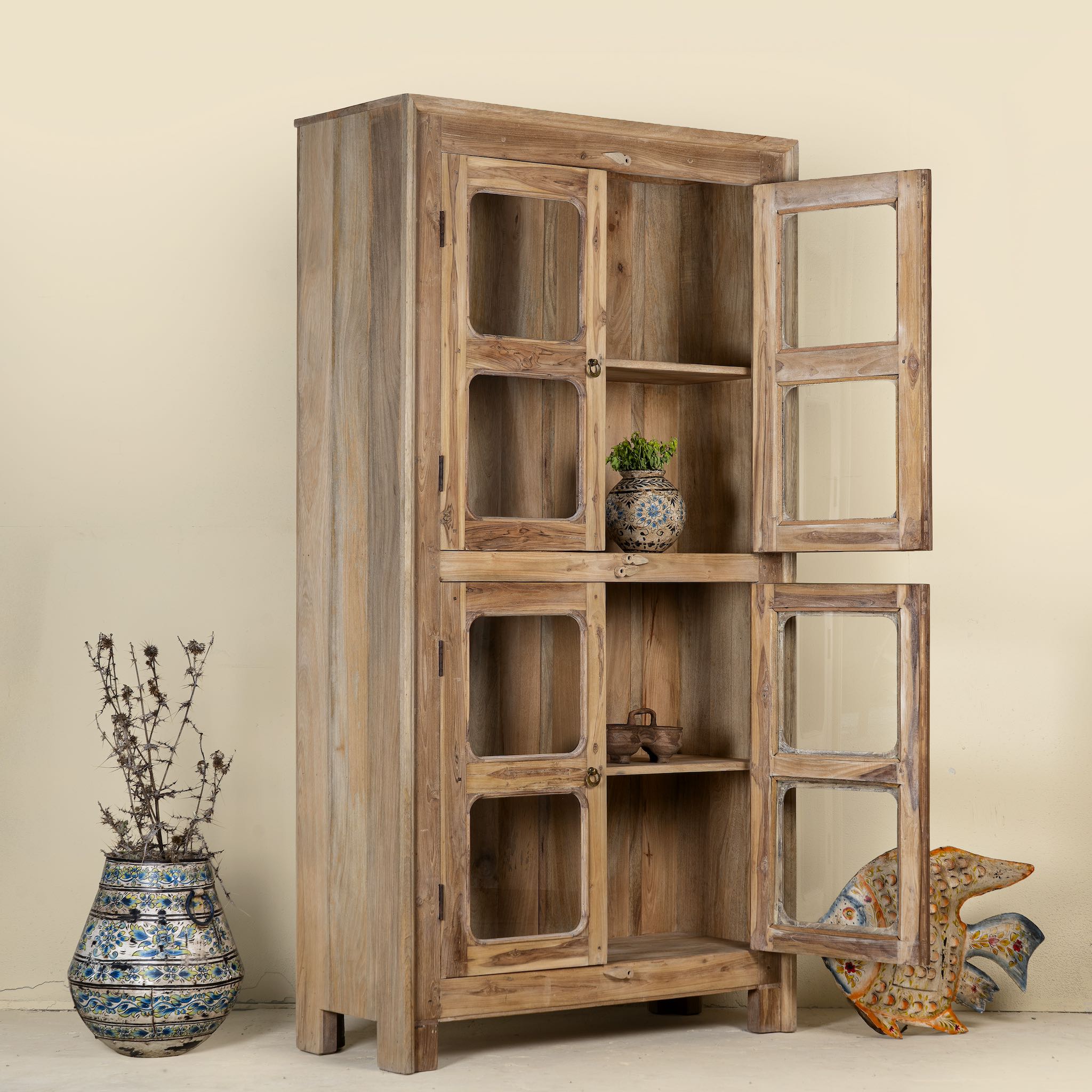 Open door image of Chander tall vitrine with reclaimed teak door panels, a refined piece of teak wood furniture for living room furniture collections.