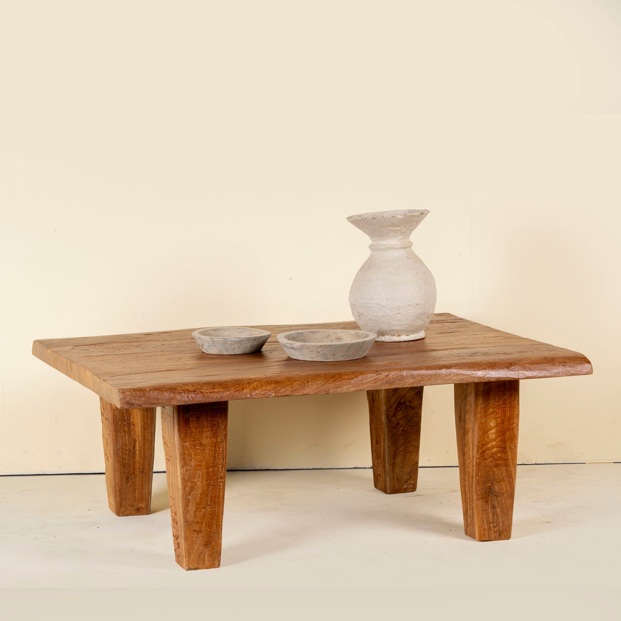 Handcrafted reclaimed wood coffee table with rounded edges and rustic grain; perfect for rustic interiors, 120 × 90 × 48 cm.