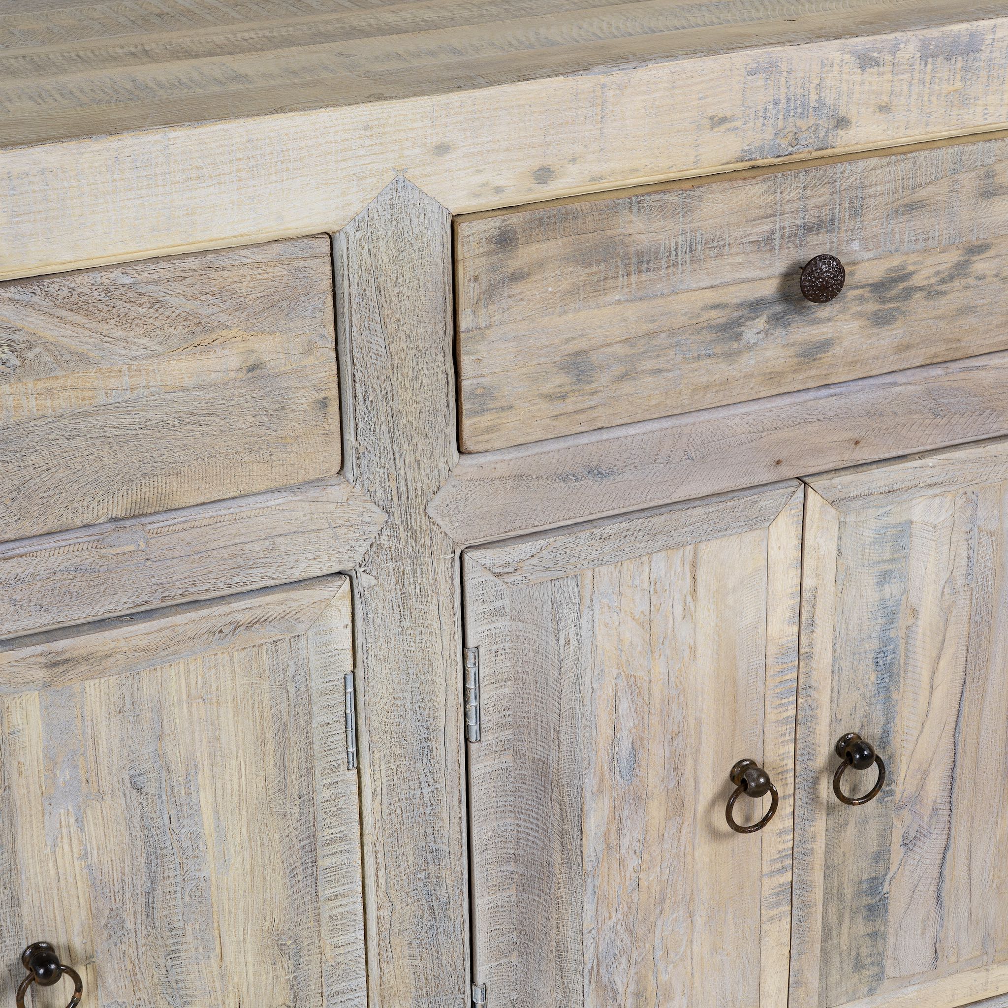Close up image of a sustainable bathroom sideboard made of reclaimed wood with four cupboards and three drawers, rustic finish, 180 × 40 × 90 cm.