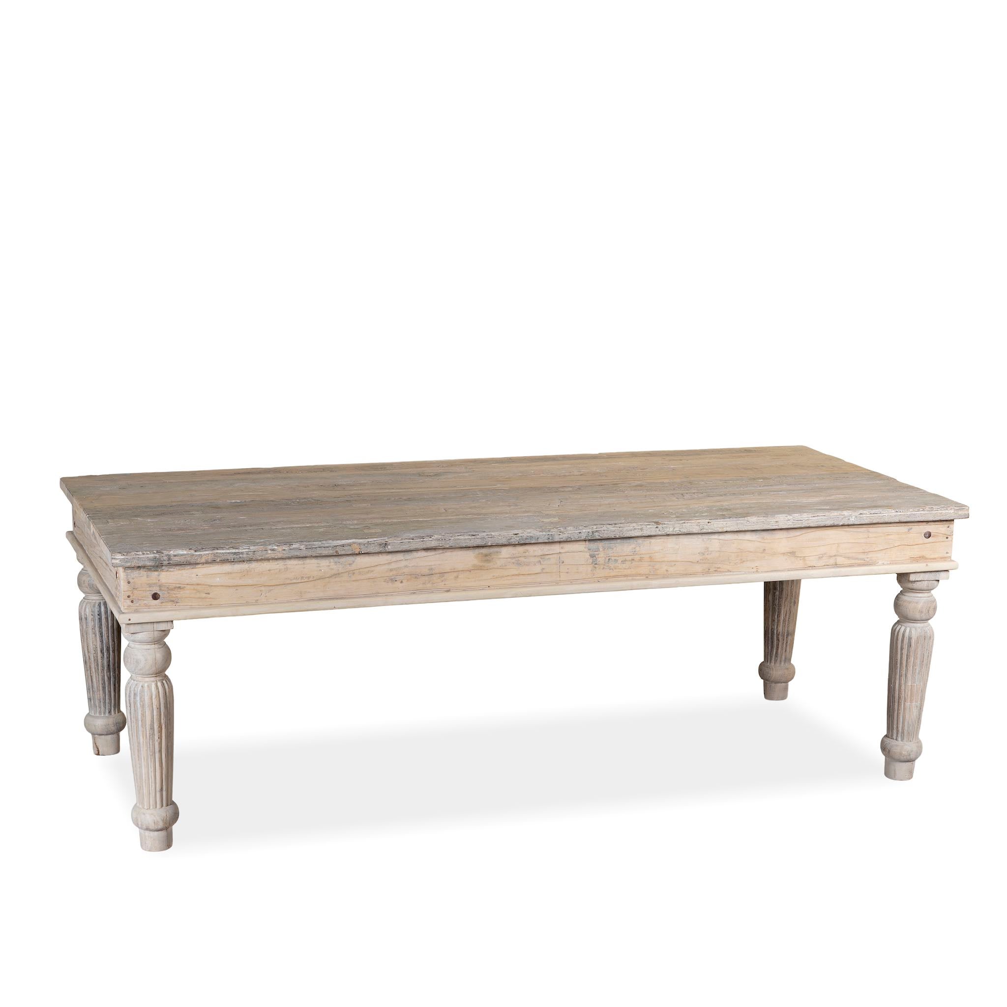 White background image of a sandblasted reclaimed wood dining table with carved legs, sustainable dining room furniture, 220×100×75 cm.