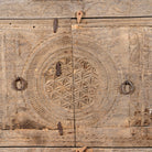 Close up image of a reclaimed wood sideboard made from antique teak doors with carved detailing; teak furniture, 134 × 37 × 82 cm.