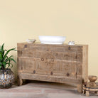 Side angle image of Etasha, a reclaimed wood sideboard made from antique teak doors with carved detailing; teak furniture, 130 × 38 × 83 cm.