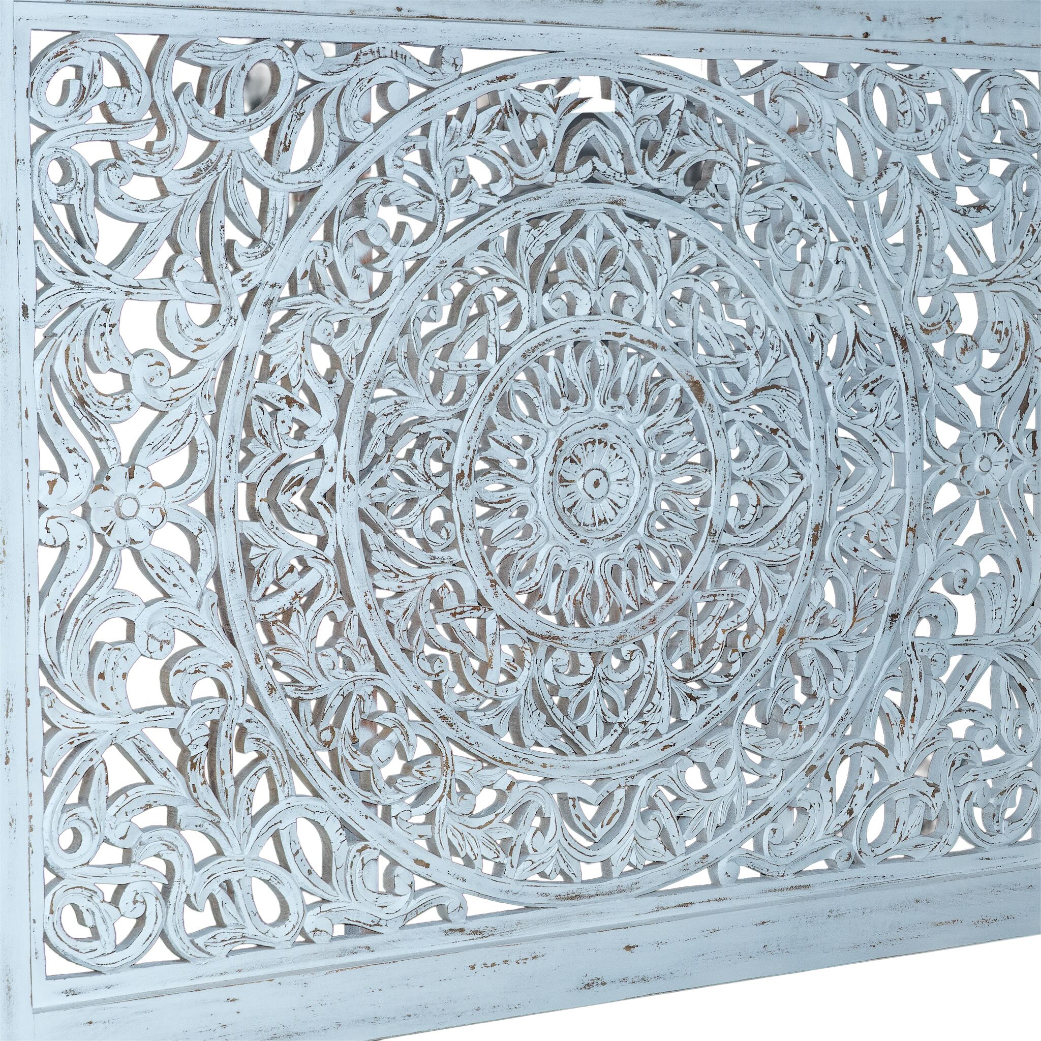 Close up image of a hand-carved wooden bed made of mango wood with large floral panel in white finish – Flair model by Om Home & Garden