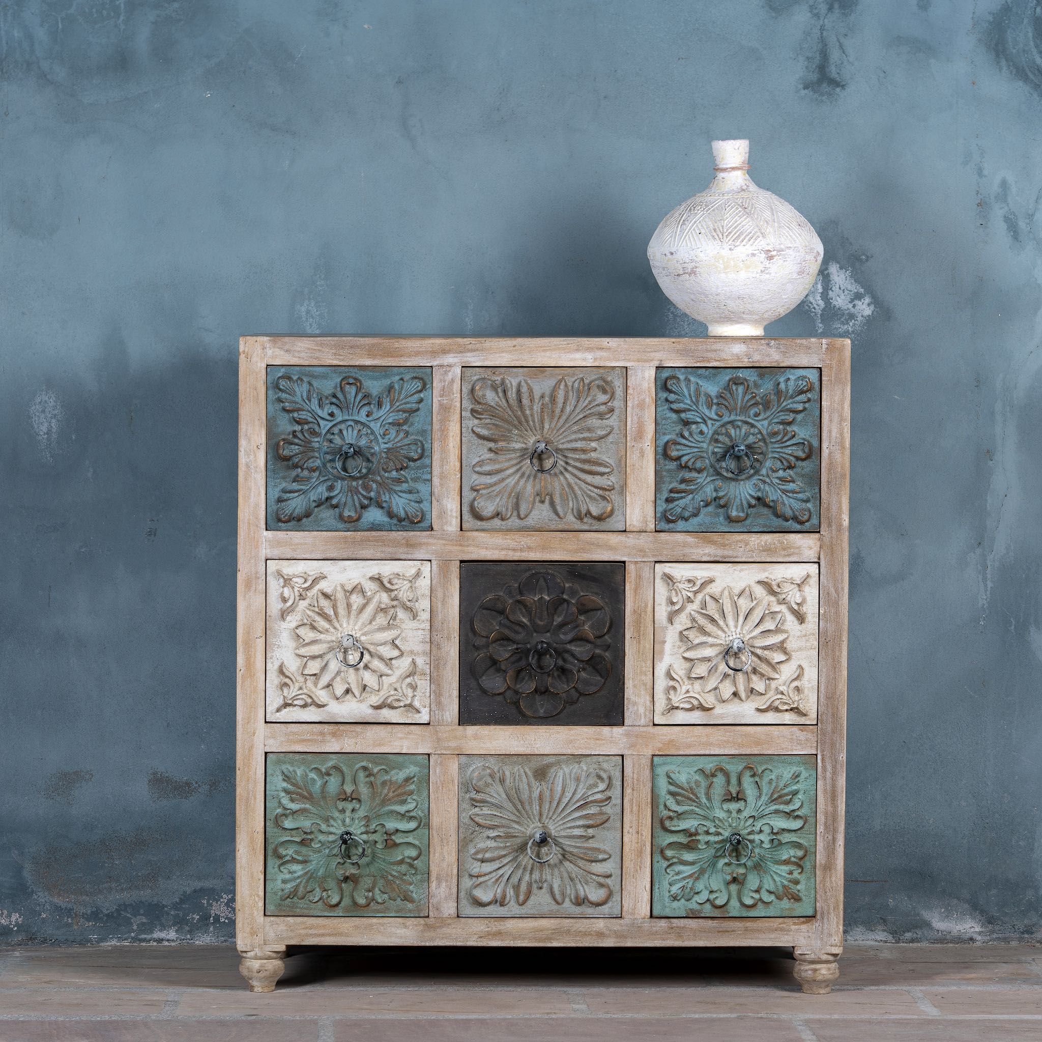 Wooden chest of drawers Hansika, solid mango wood with nine multicolour floral carvings, bohemian interior style, 89 × 40 × 102 cm.