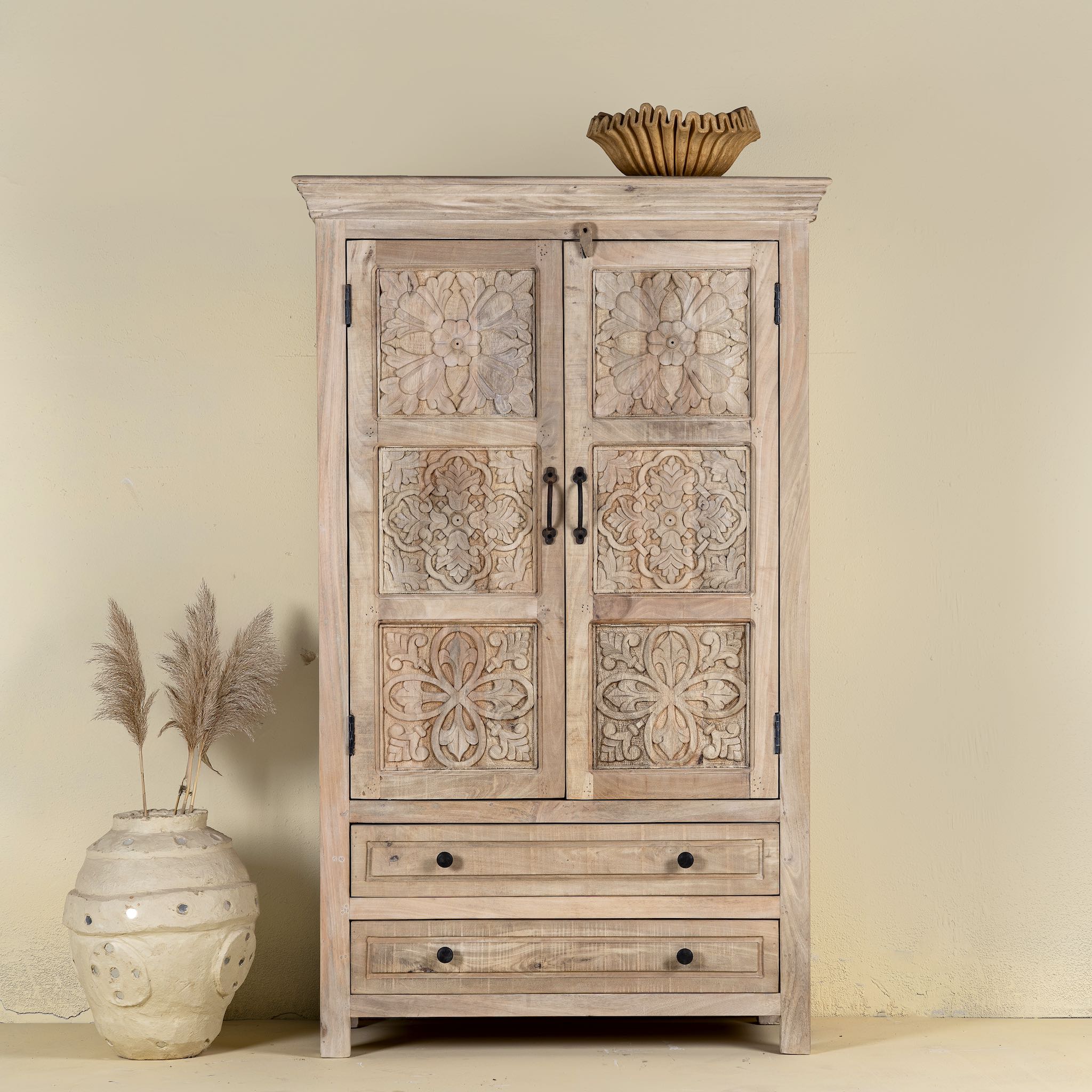 Hand-carved mango wood cabinet with floral and geometric detailing – carved wooden furniture and elegant bedroom storage by Om Home & Garden.