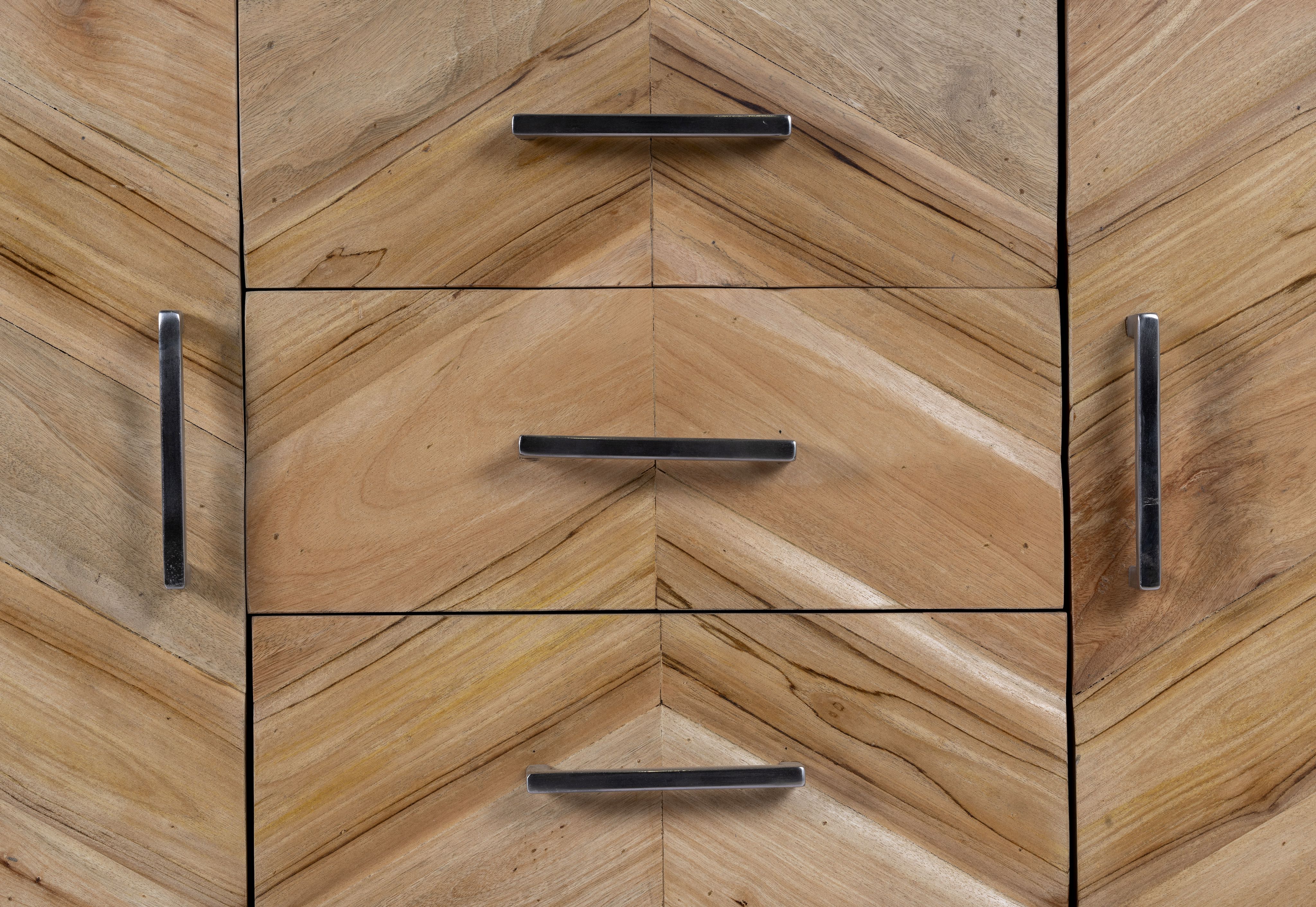 Close up image of a handcrafted teak wood sideboard with parquet design and grey stainless steel frame—artisanal furniture ideal for a modern living room.