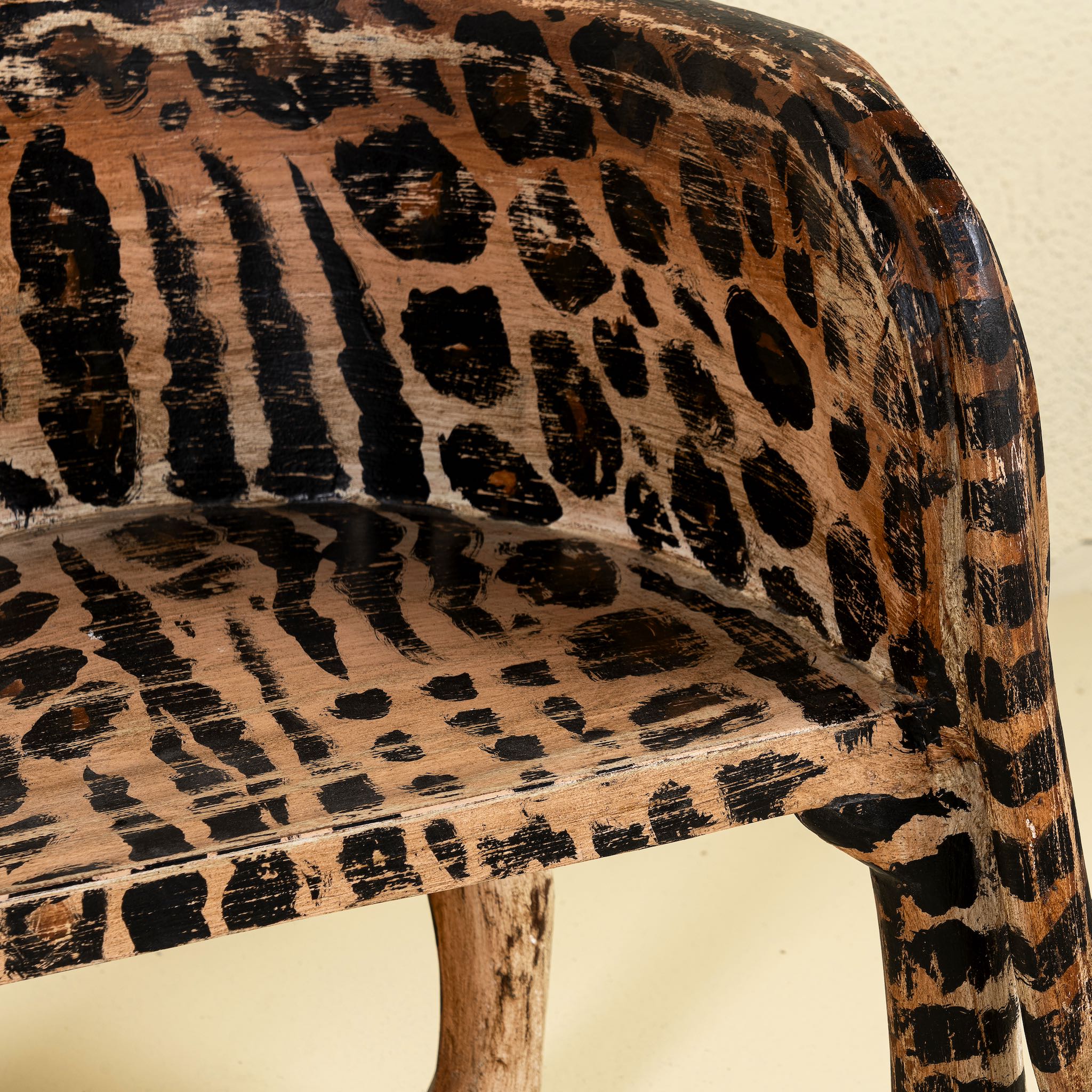 Close up view of a hand painted cat chair made of reclaimed wood, a unique decorative furniture not only for a children room. The head of the chair can be purchased in right or left direction.