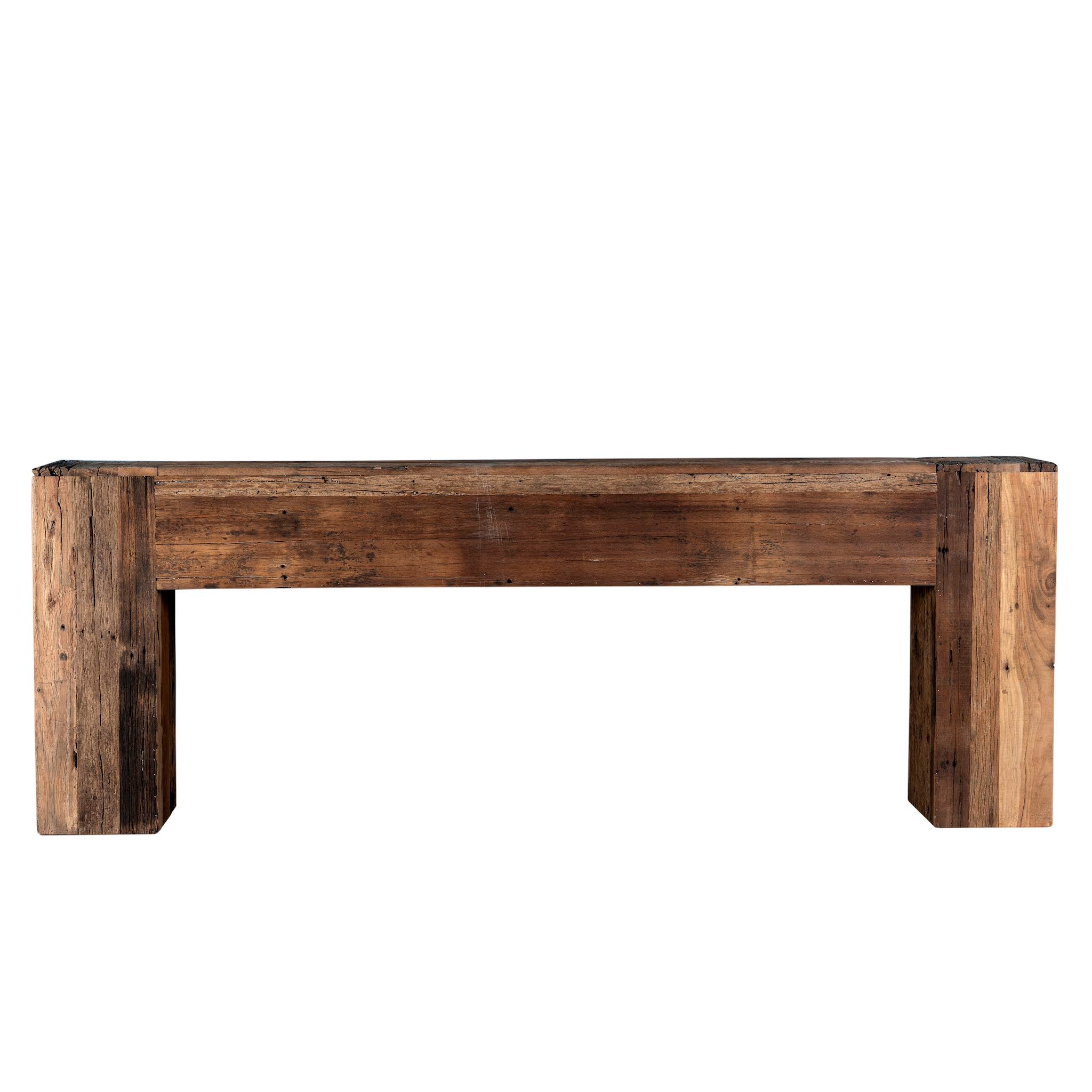 White background image of a rustic minimalistic console table made from reclaimed wood with preserved imperfections, block legs, 250 × 40 × 90 cm.