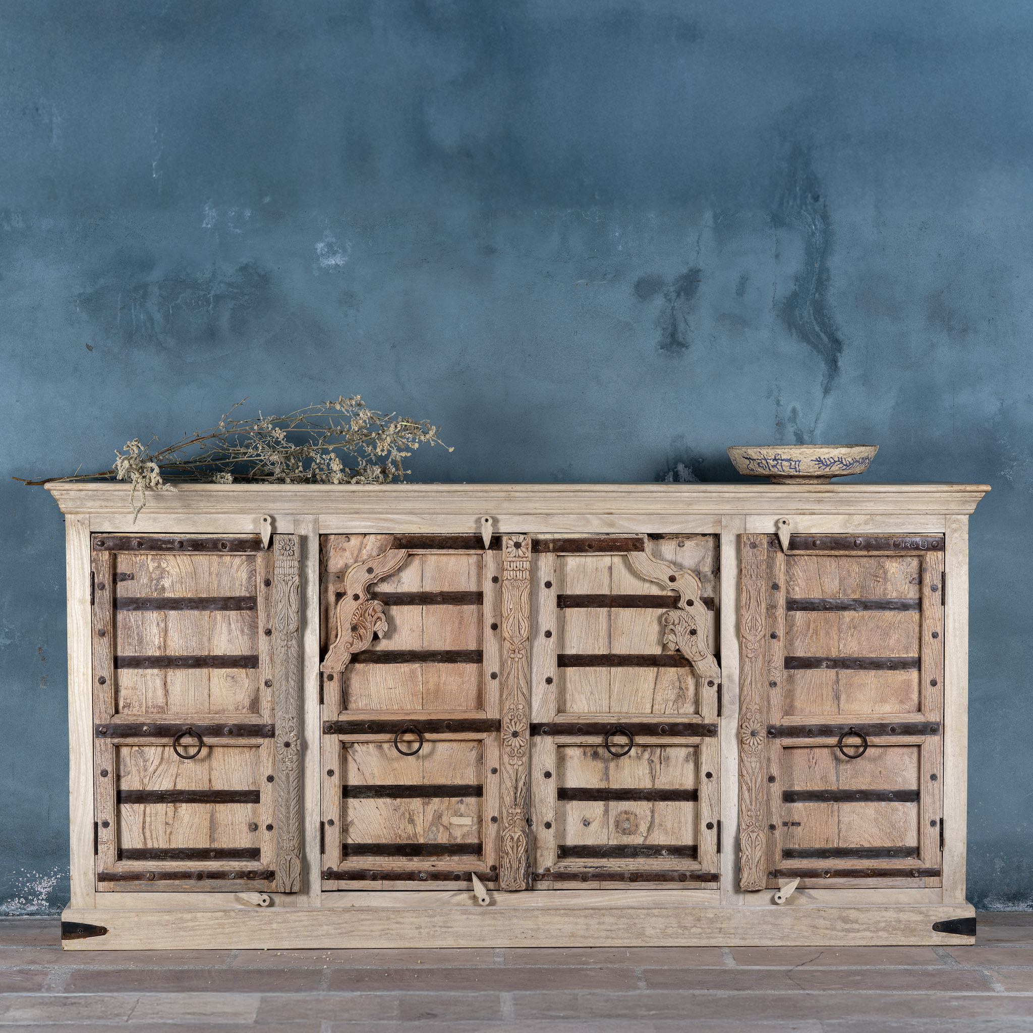 Reclaimed teak furniture sideboard with antique Indian doors, old door cabinet with hand-carved details and iron accents, 220 × 45 × 110 cm.