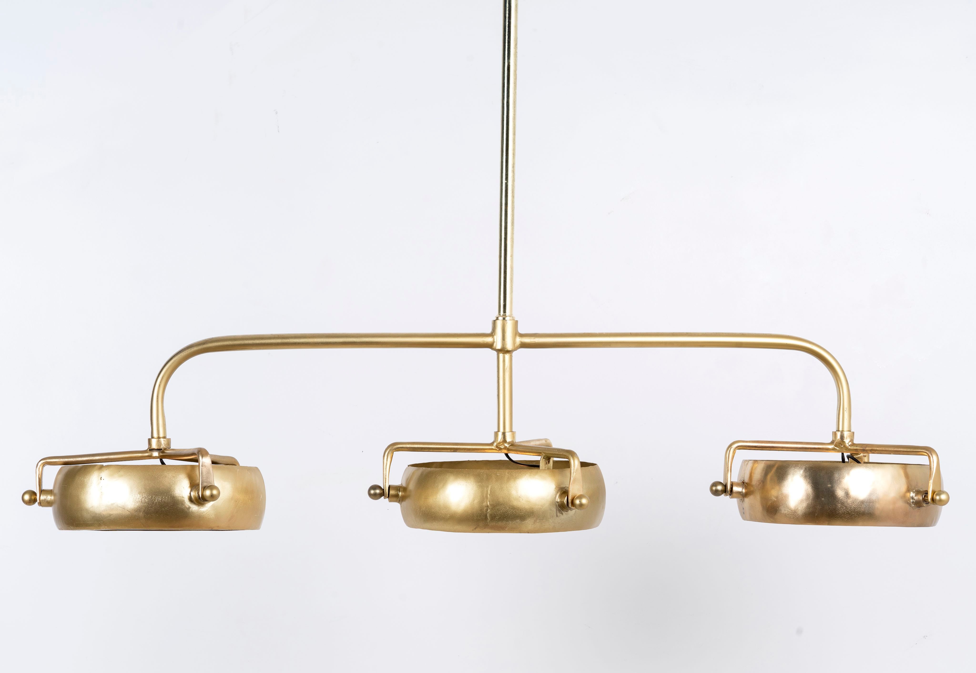 Elongated vintage pendant lamp with brass-plated frame and three clear glass shades – artsy lighting ideal for kitchens, dining rooms, or entryways.