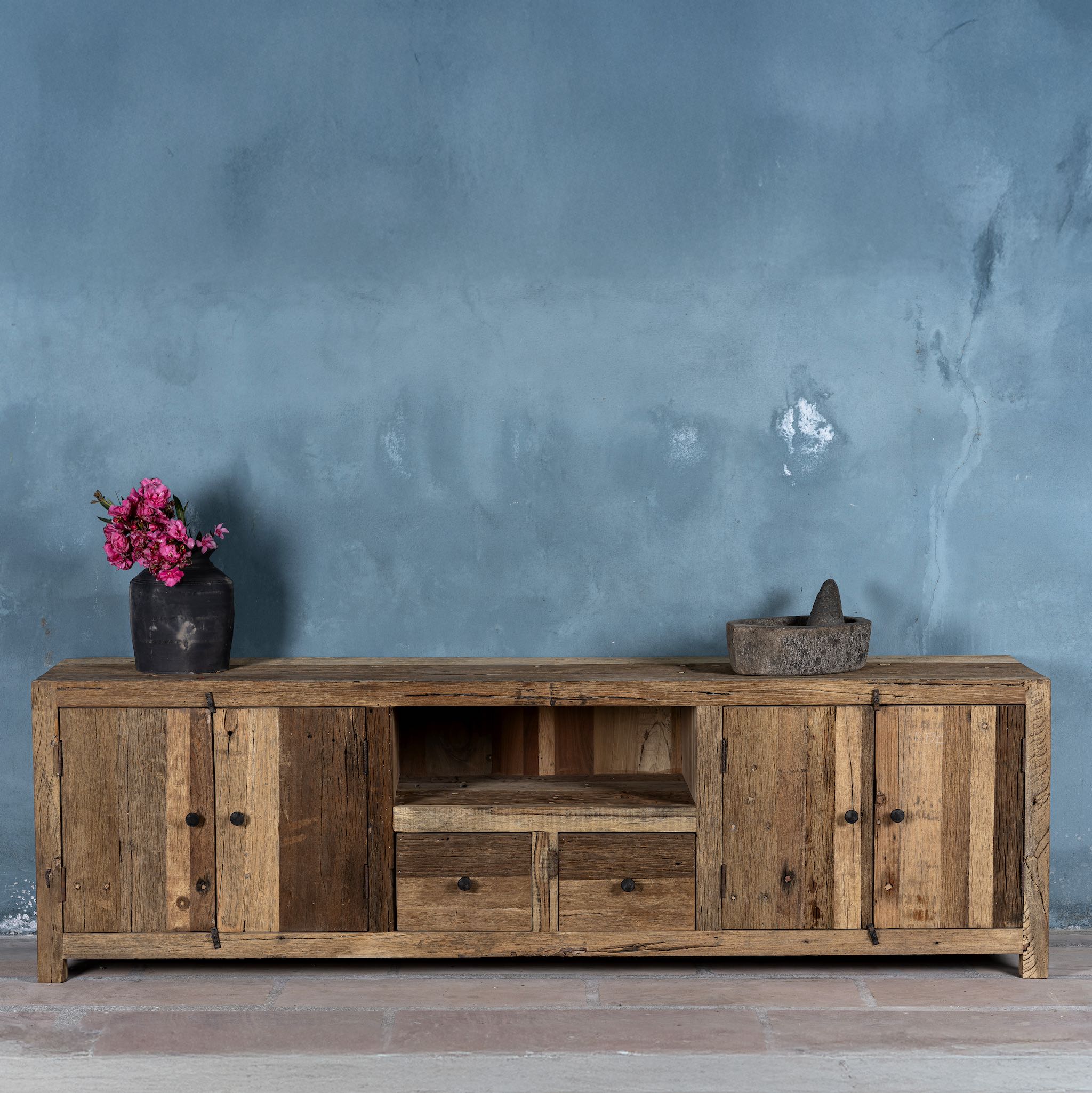 Sustainable driftwood sideboard with two drawers, open shelf, and cabinets; made from reclaimed wood, 200 × 45 × 60 cm.
