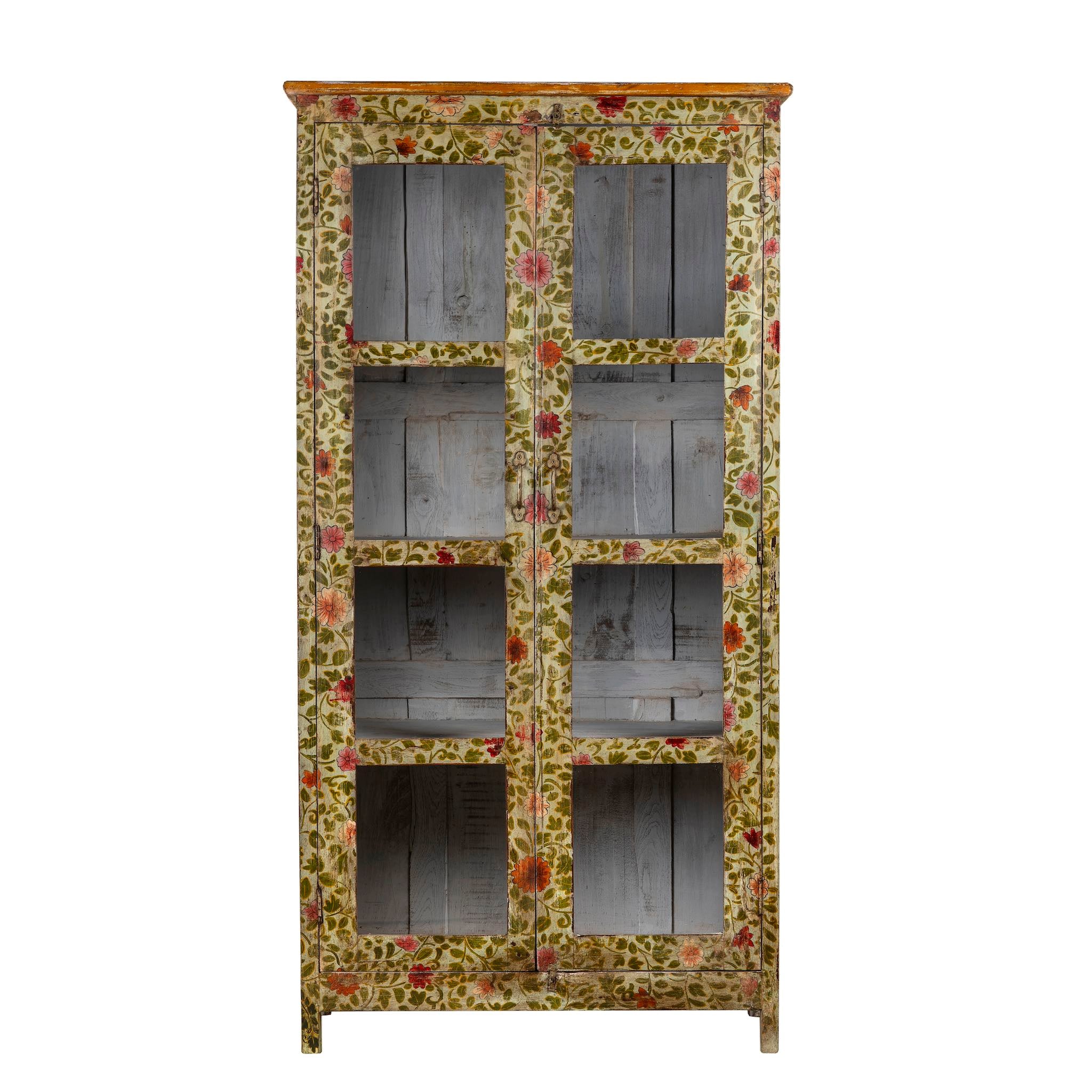 White background image of a hand-painted reclaimed wood cabinet with glass doors and floral motifs – sustainable and artistic furniture for vintage or bohemian interiors.