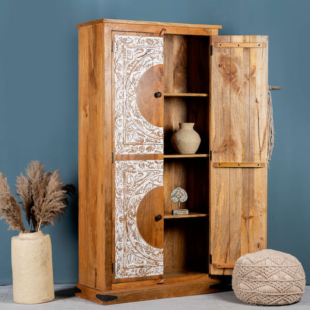 Side angle image with open door of a mango wood furniture cabinet with full front floral carving, artisanal bedroom furniture with hand-carved details, 180 × 90 × 40 cm.