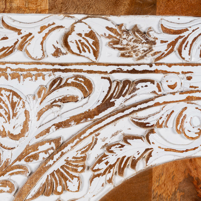 Close up image of a mango wood furniture cabinet with full front floral carving, artisanal bedroom furniture with hand-carved details, 180 × 90 × 40 cm.