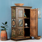 Side angle image with open door of a hand-painted cabinet made from recycled wood with floral motifs – sustainable furniture and unique furniture for bold, artistic interiors.