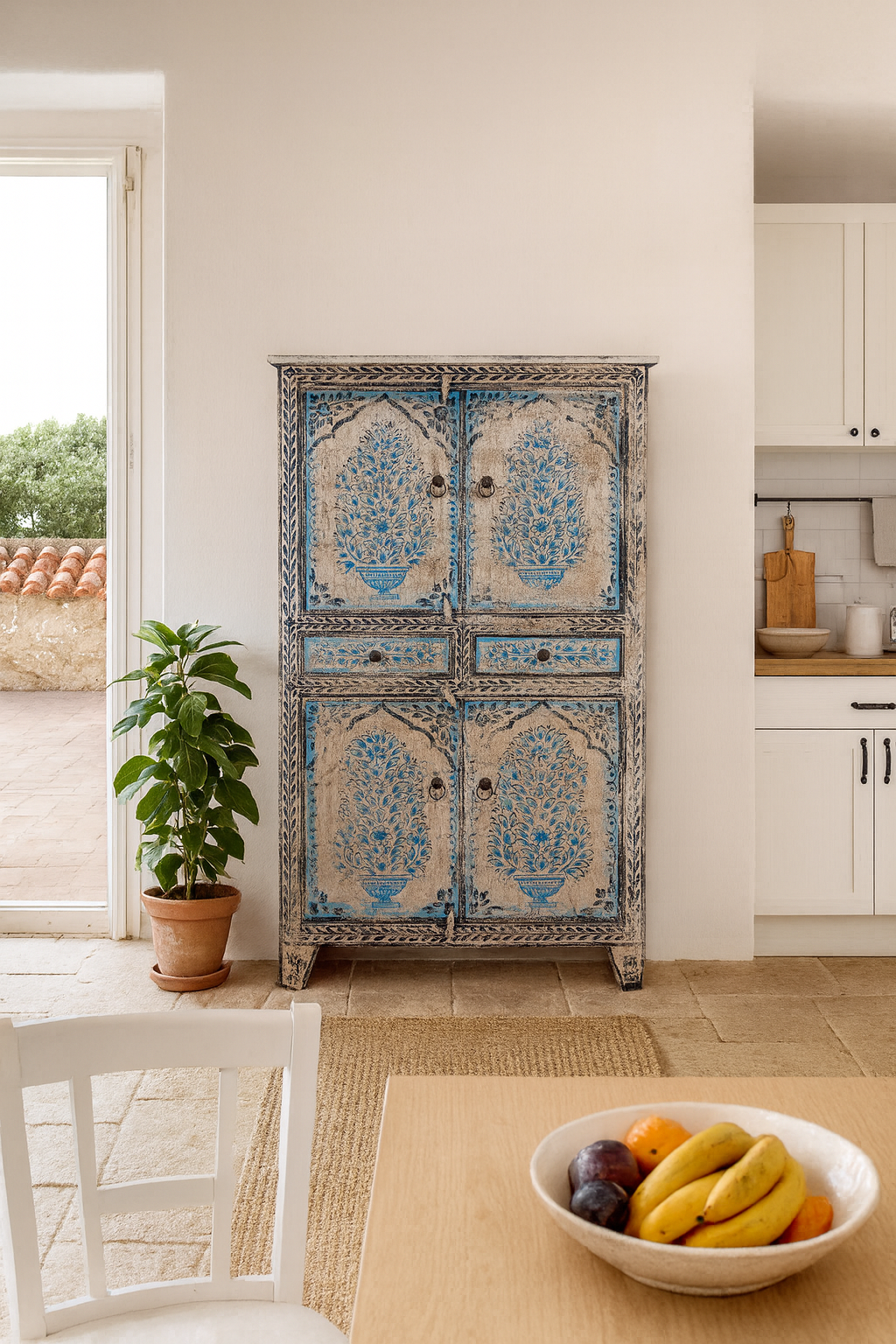 Lifestyle image of a hand-painted wooden cabinet made from reclaimed wood with blue floral motifs – sustainable furniture with artistic charm and vintage appeal.