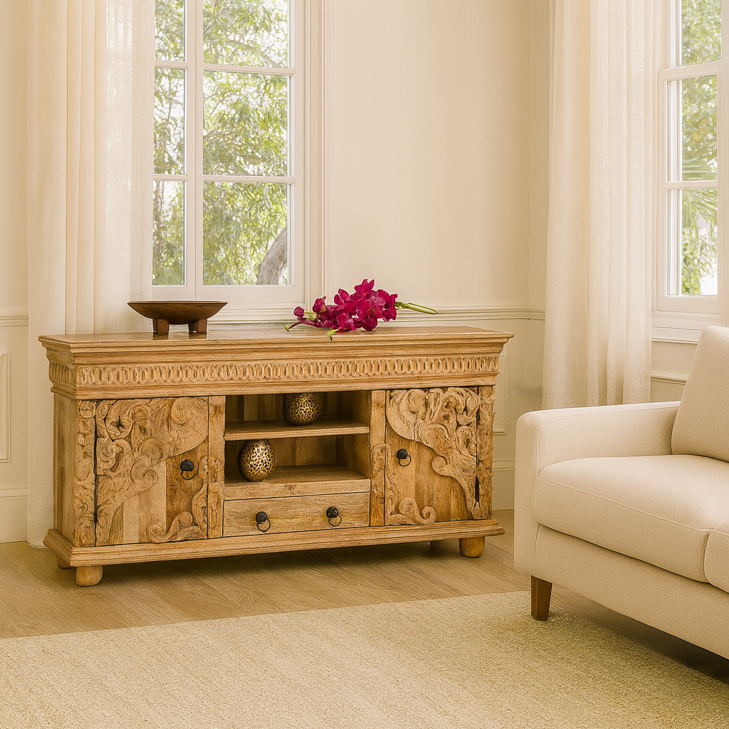 Lifestyle image of a hand-carved mango wood lowboard with two doors, one drawer, and open shelving; carved wooden sideboard for living or media room, 160 × 75 × 40 cm.