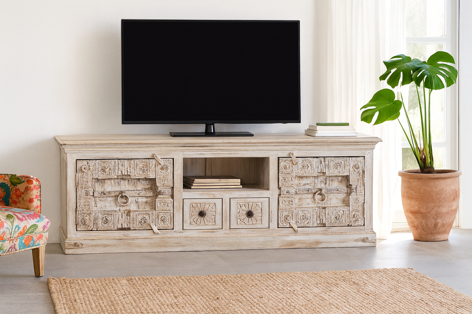 Lifestyle imagination of a old door cabinet with hand-carved antique teak panels, whitewashed mango wood body, drawers and shelf, 180 × 40 × 70 cm.