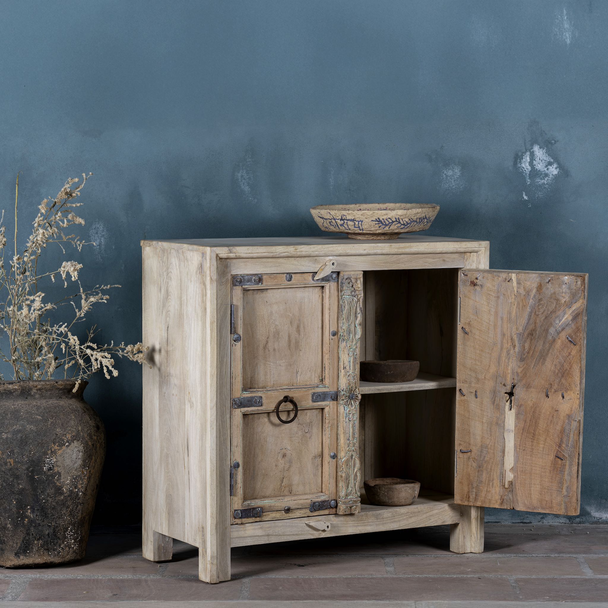 Open door view view of a unique old Door cupboard finely hand carved in bleached teak wood, driftwood design with iron fittings.