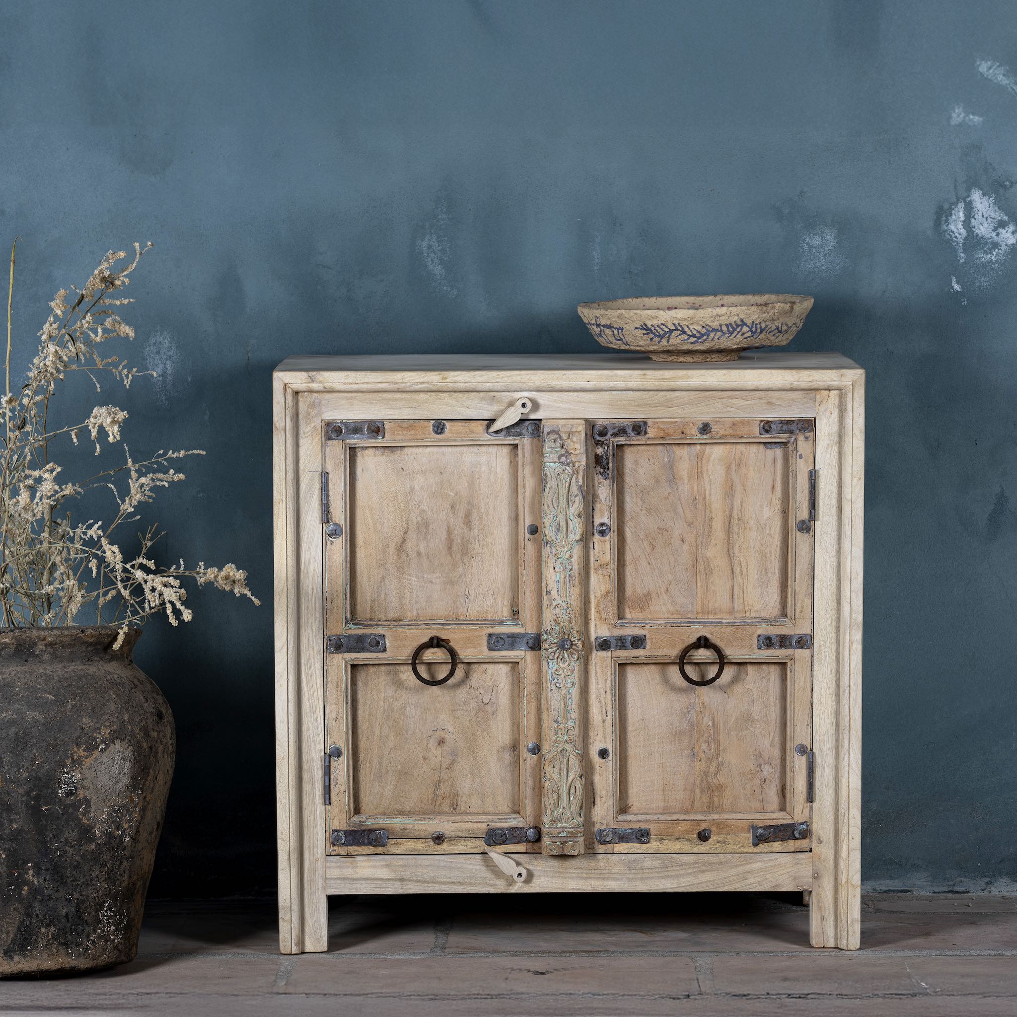Front view of a unique old Door cupboard finely hand carved in bleached teak wood, driftwood design with iron fittings.
