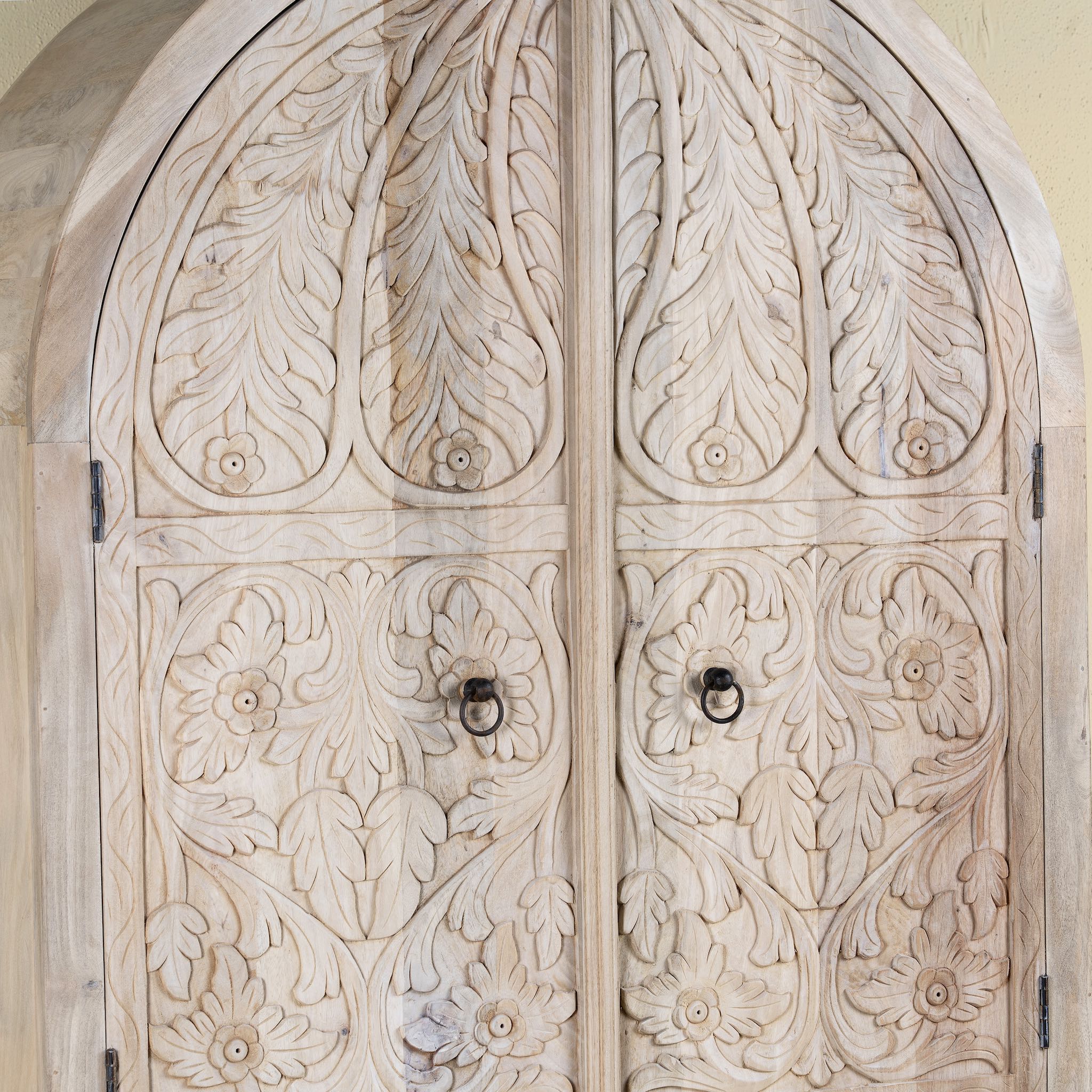Carved wooden door with intricate floral patterns