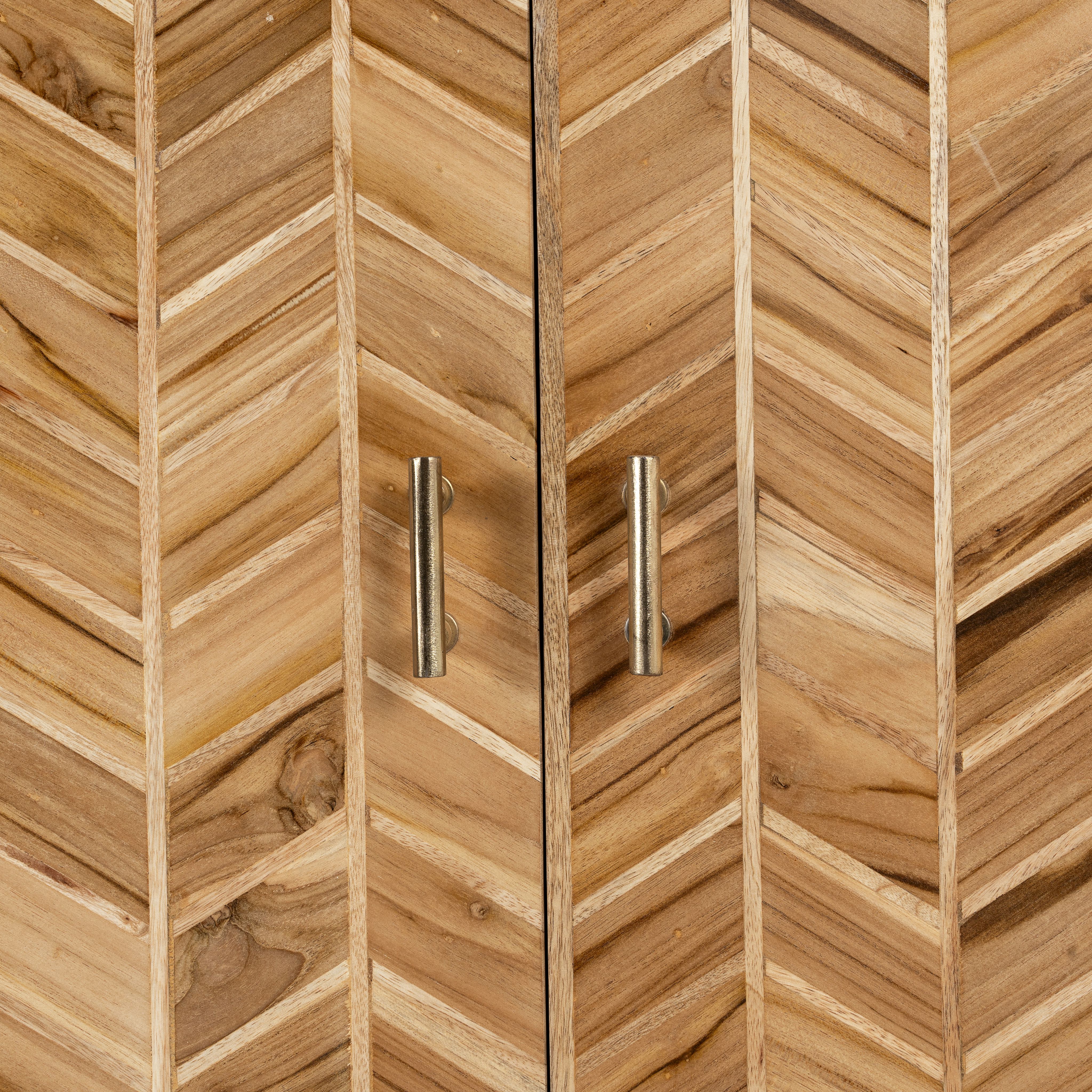 Close up image of a handmade teak wood cabinet with chevron pattern, brass stand, and handles—minimalistic style living room furniture with modern and natural appeal.