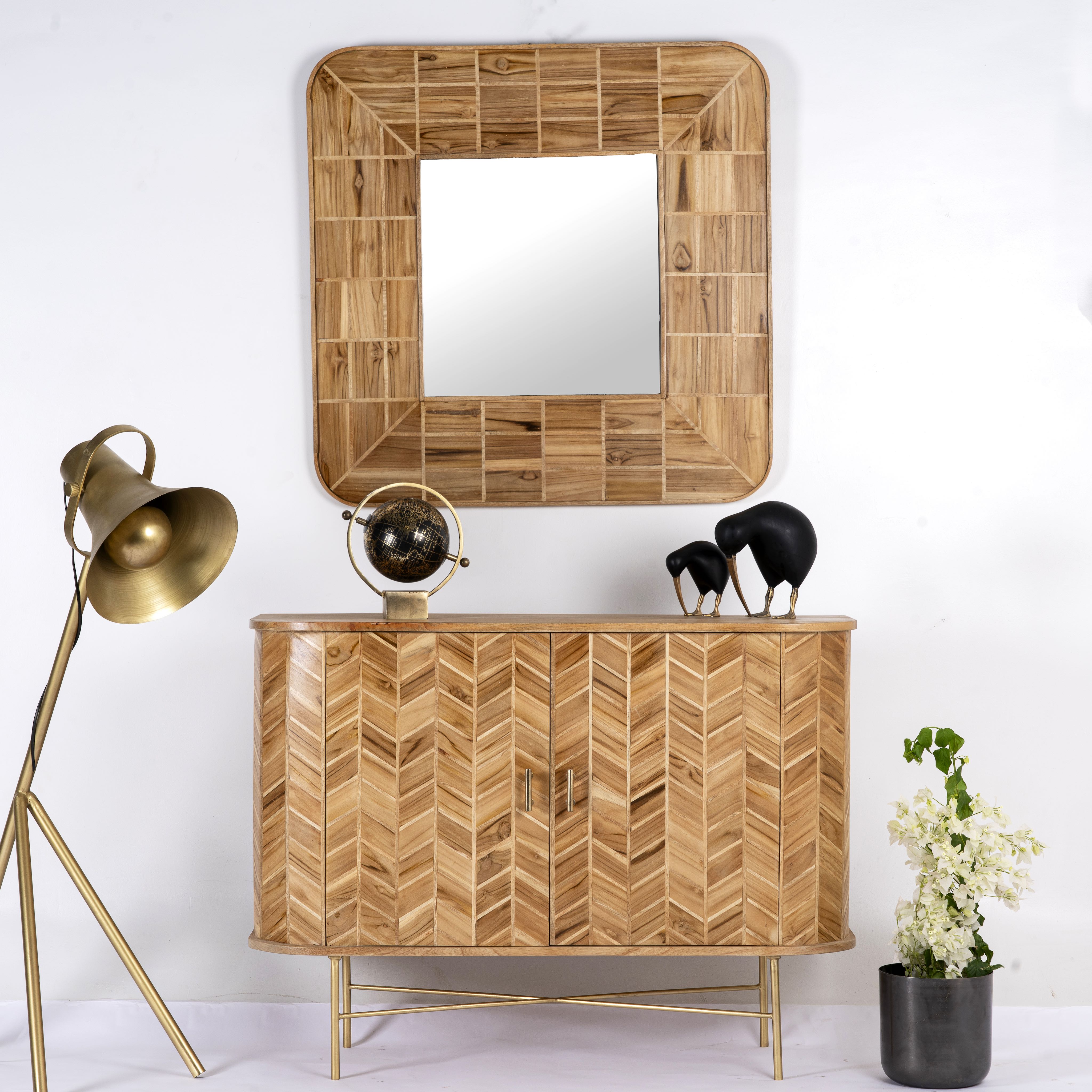 Handmade teak wood cabinet with chevron pattern, brass stand, and handles—minimalistic style living room furniture with modern and natural appeal.