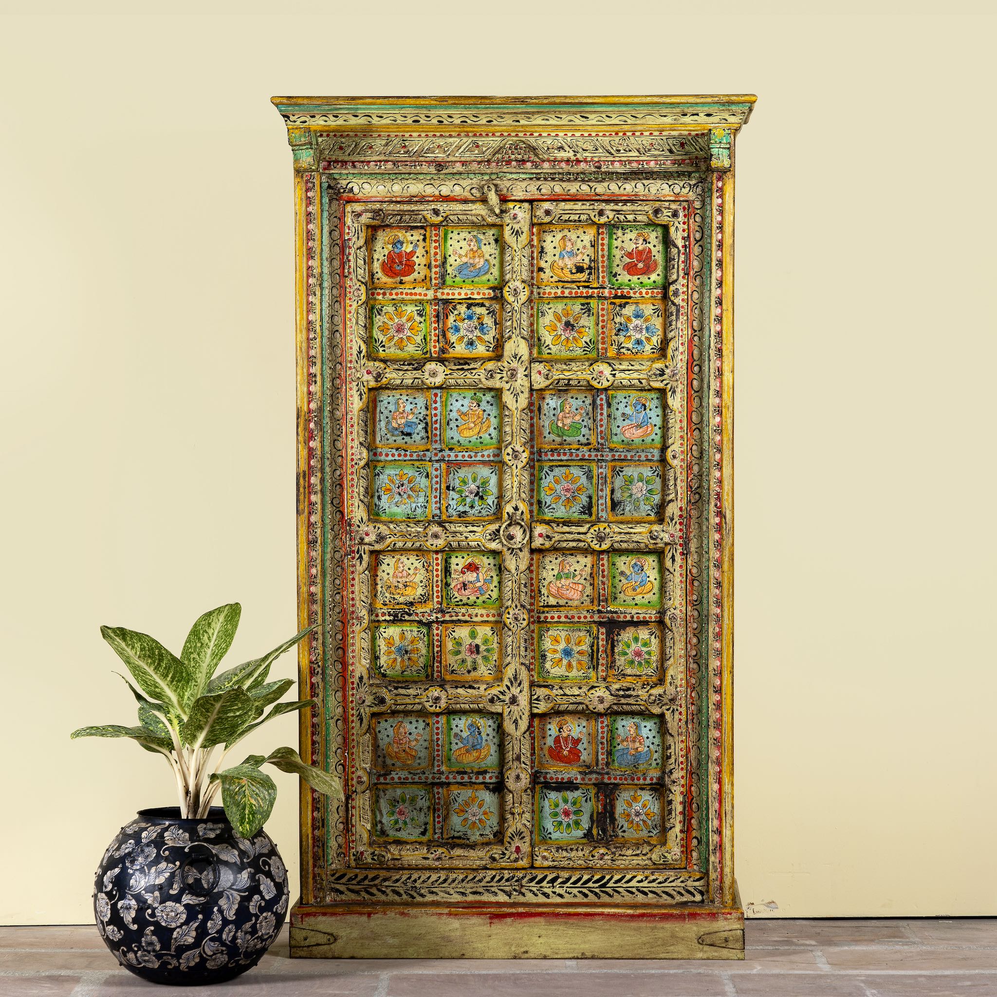 Hand painted wardrobe made of teak wood with floral motifs; unique furniture inspired by Indian artistry, 104 × 50 × 186 cm.