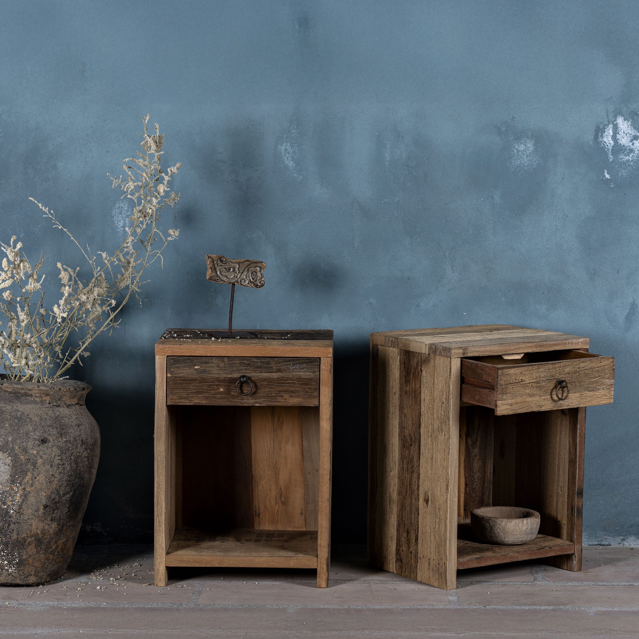 Side view image with open drawer of a reclaimed wood bedside table with drawer and open shelf – handcrafted driftwood furniture designed for rustic minimalism and natural interiors.