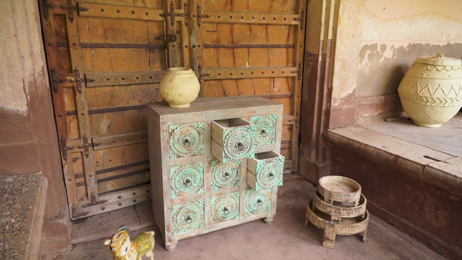 Reel showing a hand-carved mango wood vintage chest of drawers with greenwashed floral fronts and antique white finish; perfect for bedroom furniture, 90 × 100 × 40 cm.