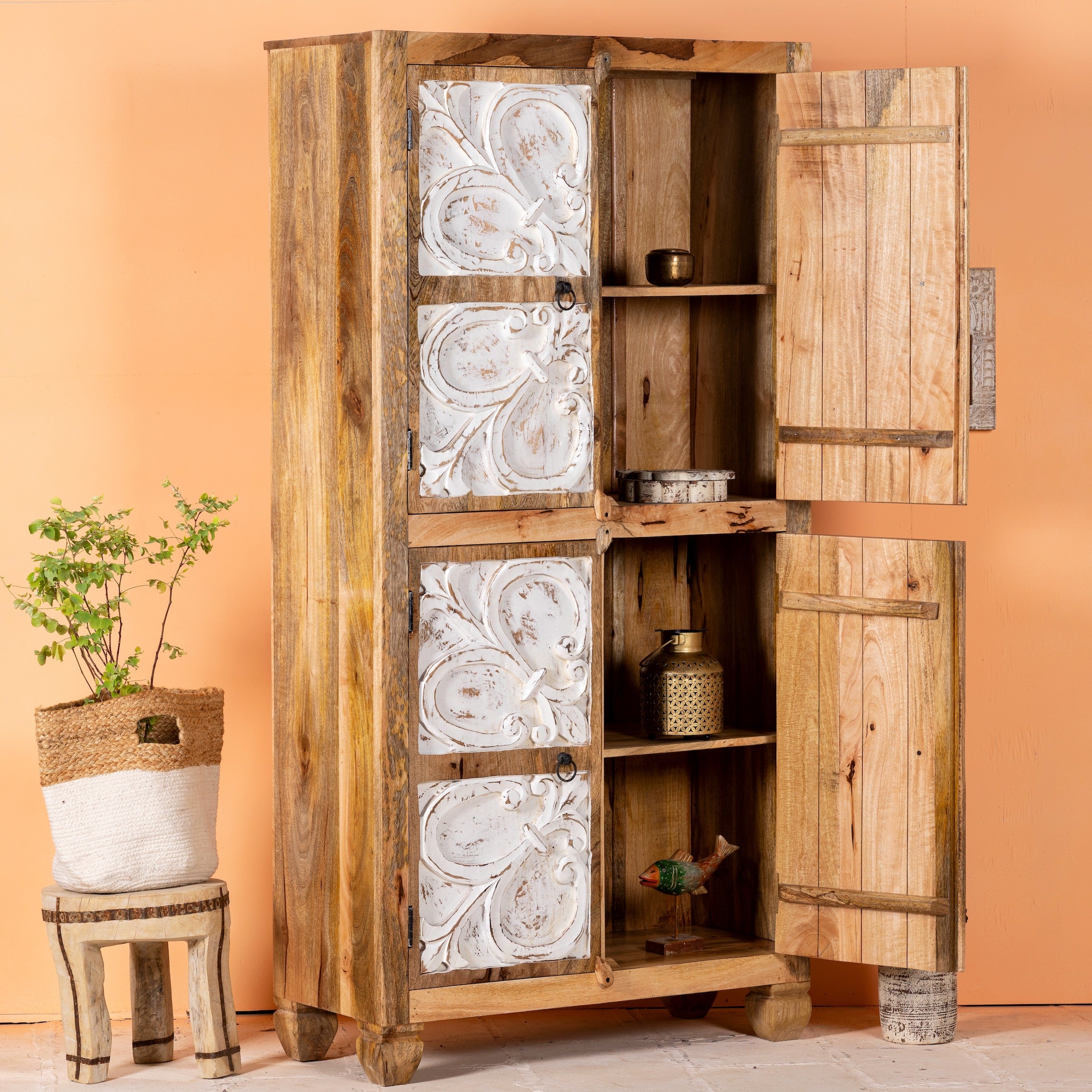 Open door image of a hand-carved mango wood wardrobe with floral motifs and whitewashed finish; wooden wardrobe ideal for bedroom furniture, 90 × 180 × 40 cm.