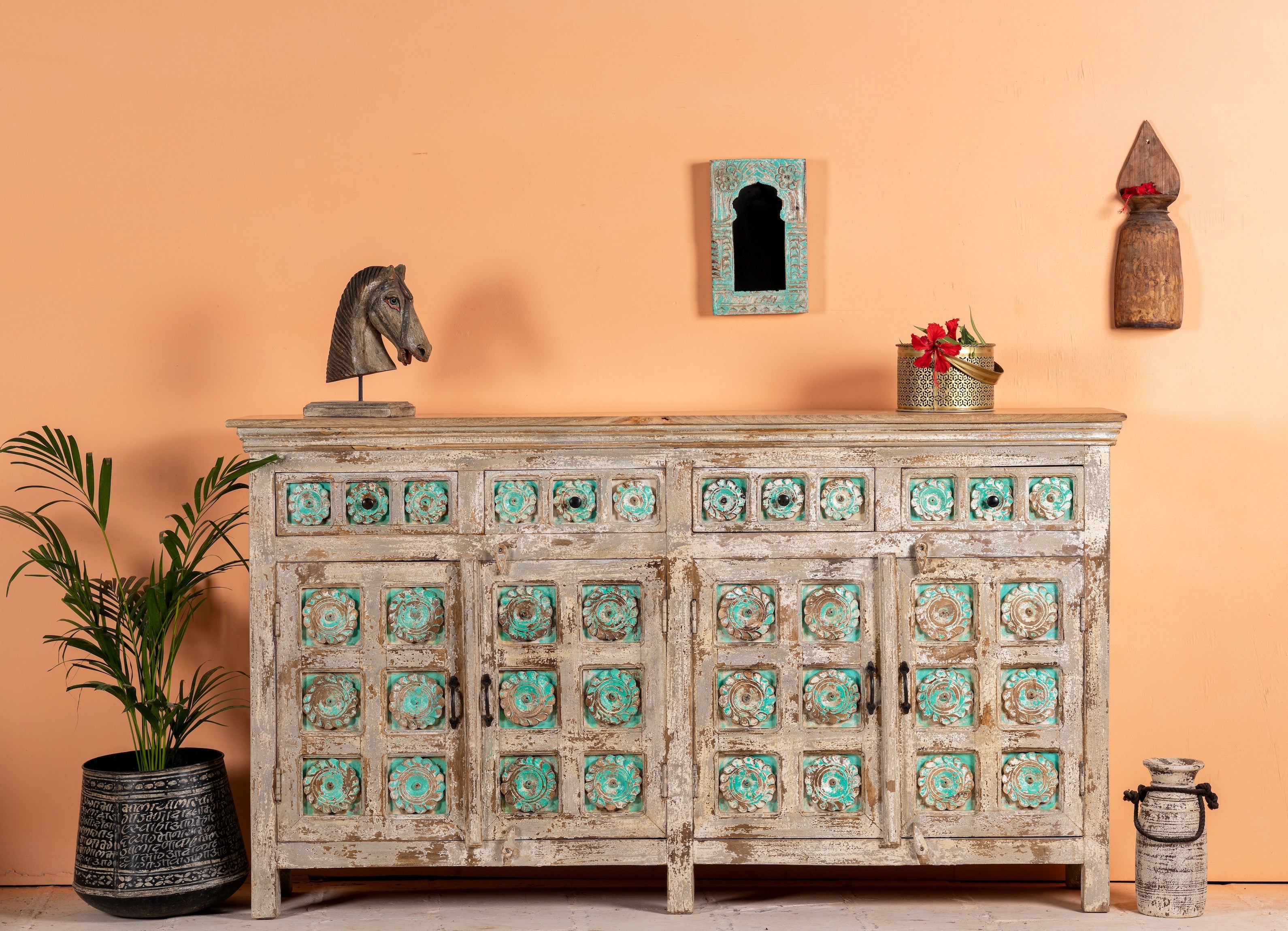 Hand-carved mango wood sideboard with green floral accents and vintage finish; perfect for bedroom furniture and bohemian interior style, 180 × 100 × 40 cm.