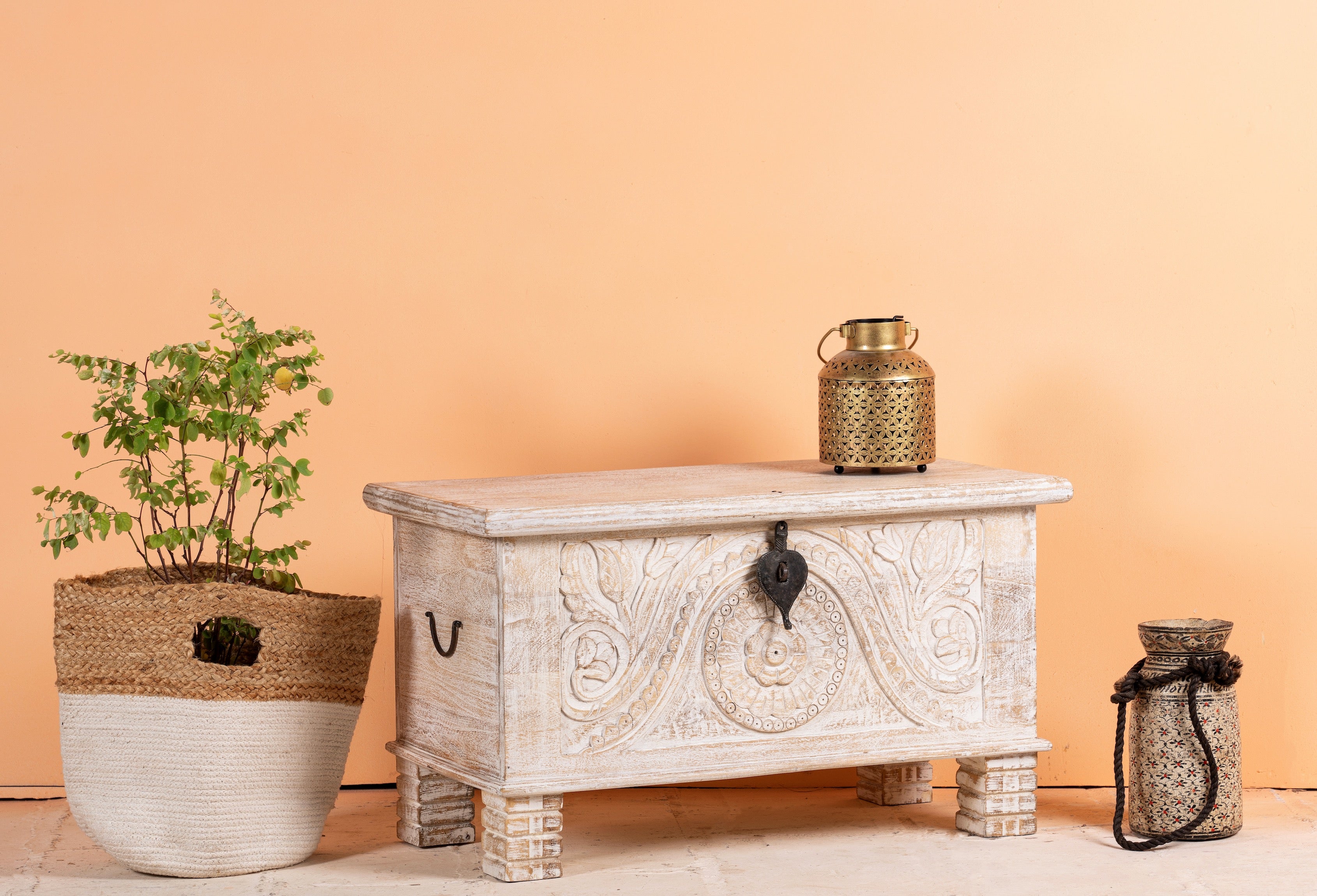 Side angle image of a hand‑carved mango wood chest with floral detailing – vintage home accessories and artisan storage chest for stylish interiors.