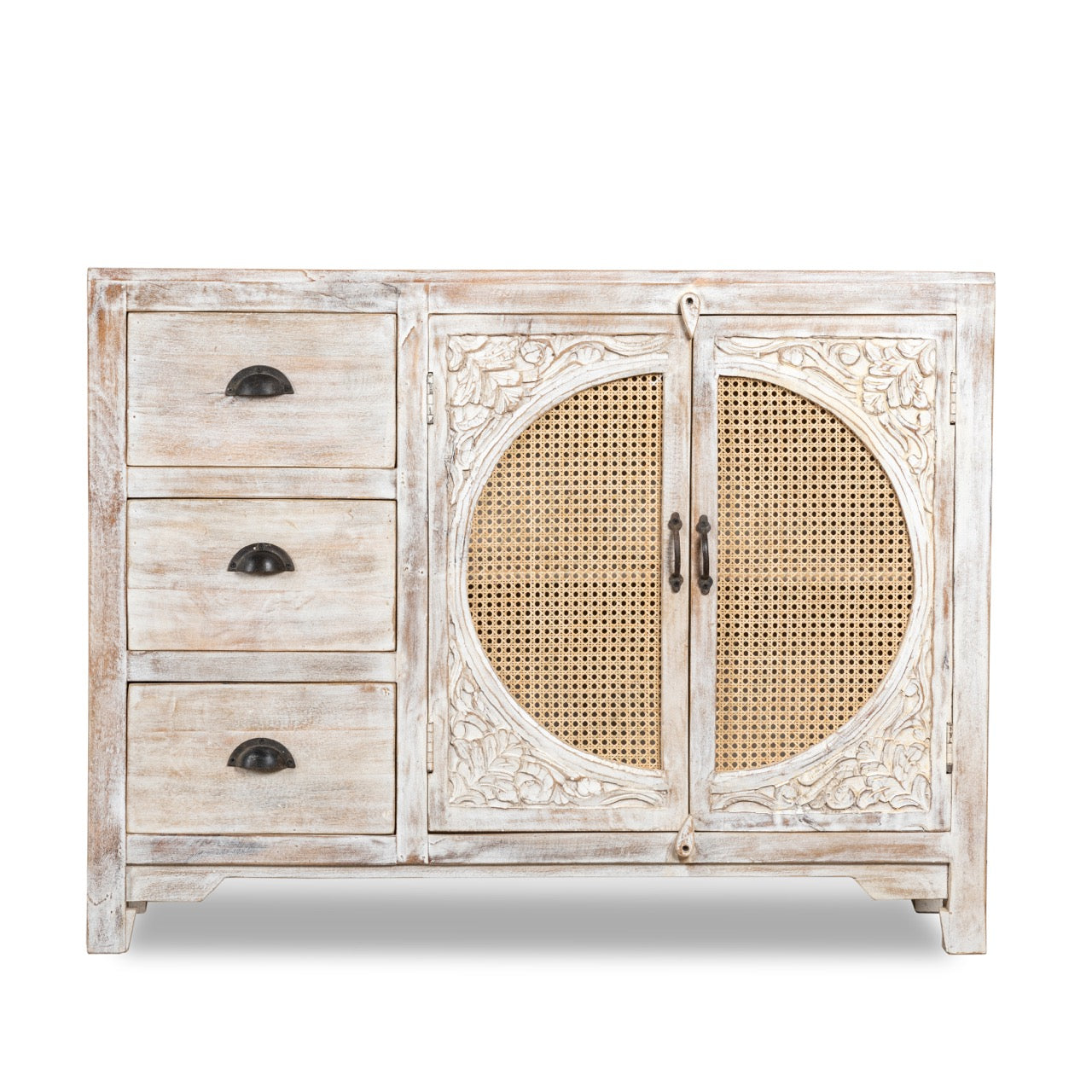 White background image of a handcrafted mango wood dresser with floral carvings and rattan cane inserts, bohemian interior and rattan furniture style, whitewashed finish, 120 × 40 × 92 cm.