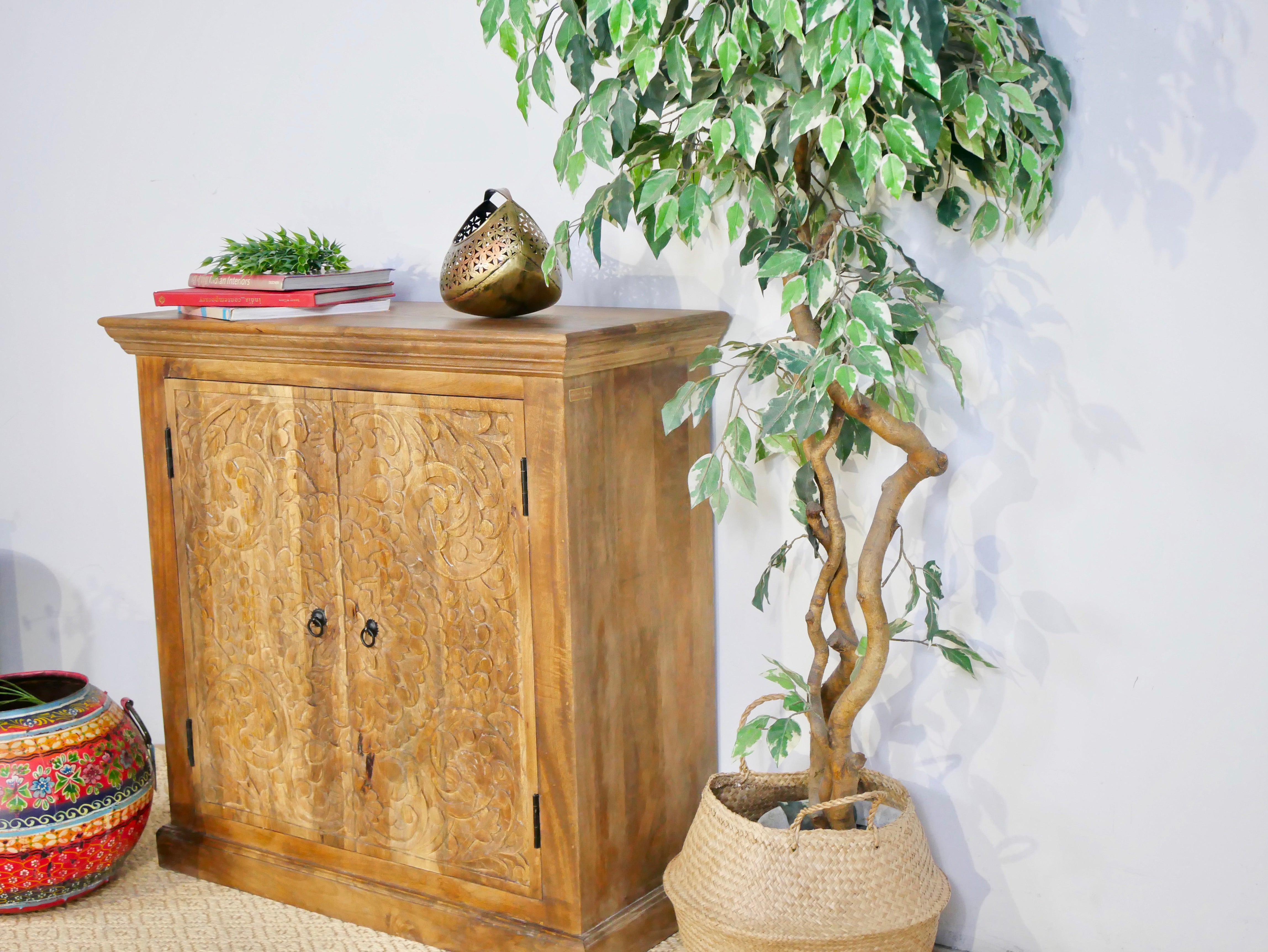 Side angle image of a mango wood cabinet with floral hand-carved doors in Mediterranean style, 90 × 90 × 40 cm – made from solid mango wood with unique grain and texture.