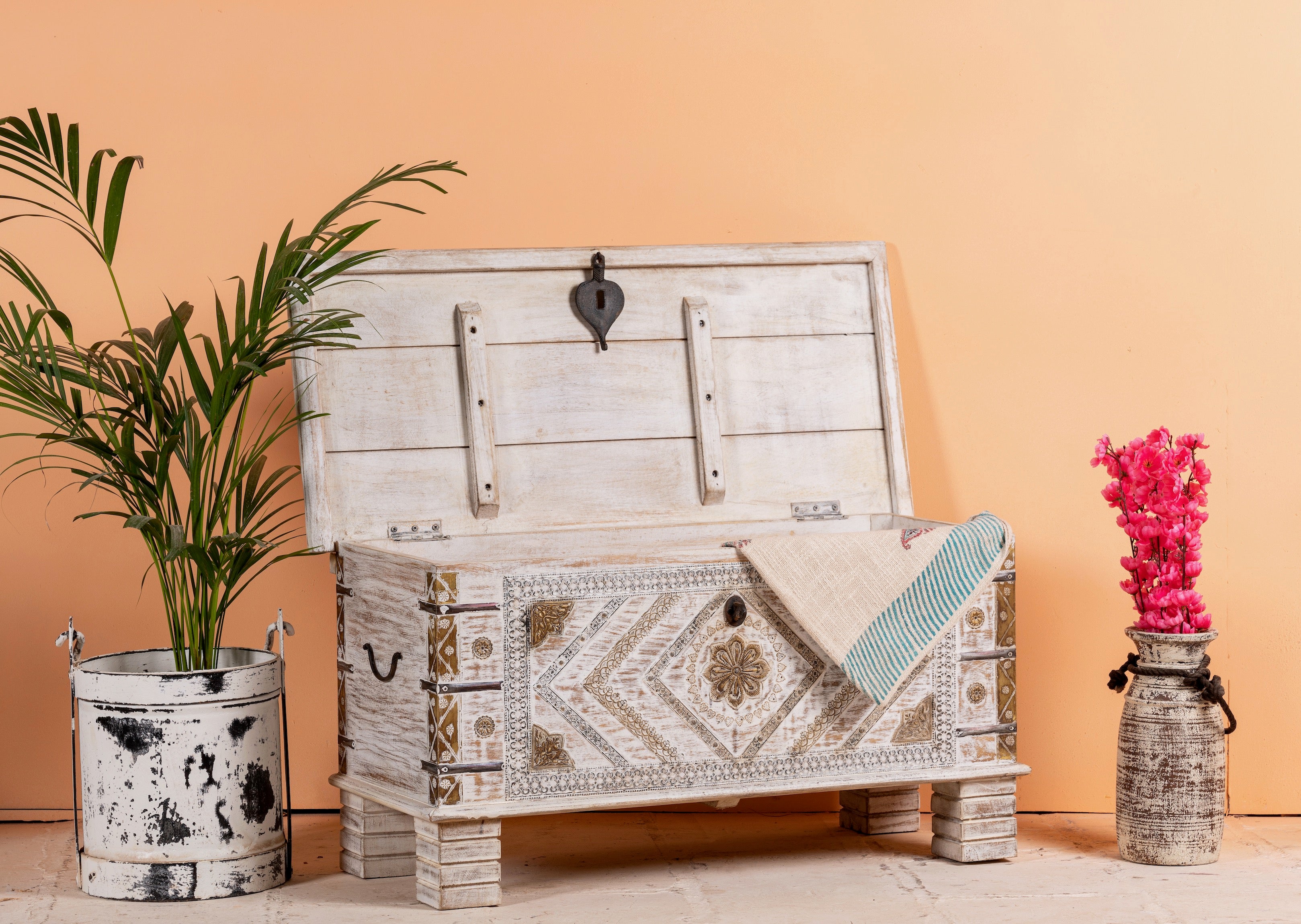Image showing chest with an open lid, handcrafted mango wood chest with brass inlays and caarvings – wood chest box for boho style interiors, perfect as coffee table or bedroom storage.