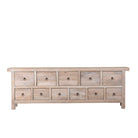 White background image of a reclaimed sandblasted wooden chest of drawers with 11 drawers, part of our Ibiza style furniture collection.
