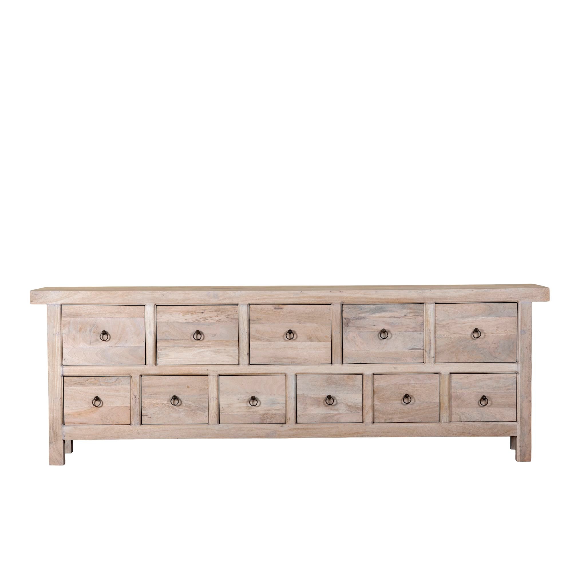 White background image of a reclaimed sandblasted wooden chest of drawers with 11 drawers, part of our Ibiza style furniture collection.