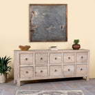 Side angle image of a reclaimed sandblasted wooden chest of drawers with 10 drawers, part of our Ibiza style furniture collection.