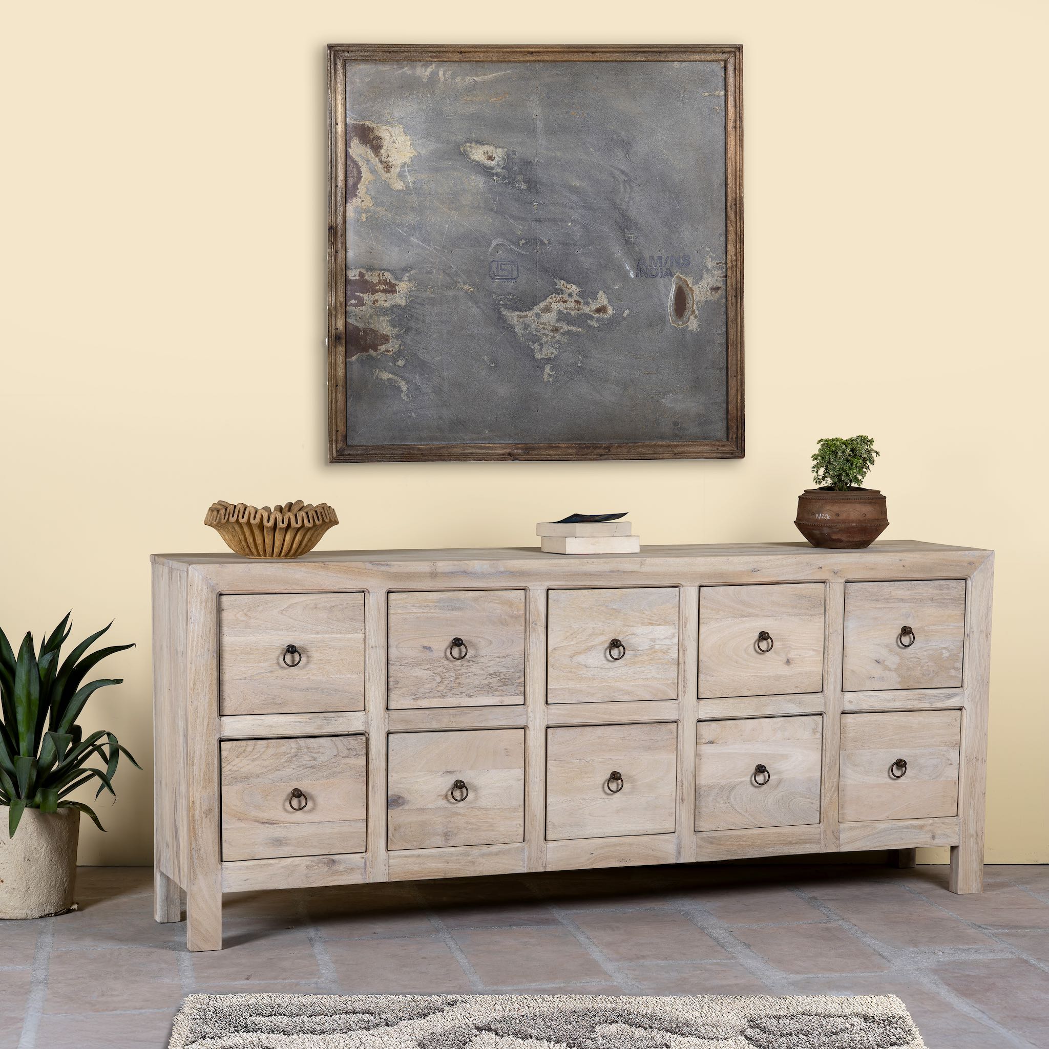 Side angle image of a reclaimed sandblasted wooden chest of drawers with 10 drawers, part of our Ibiza style furniture collection.